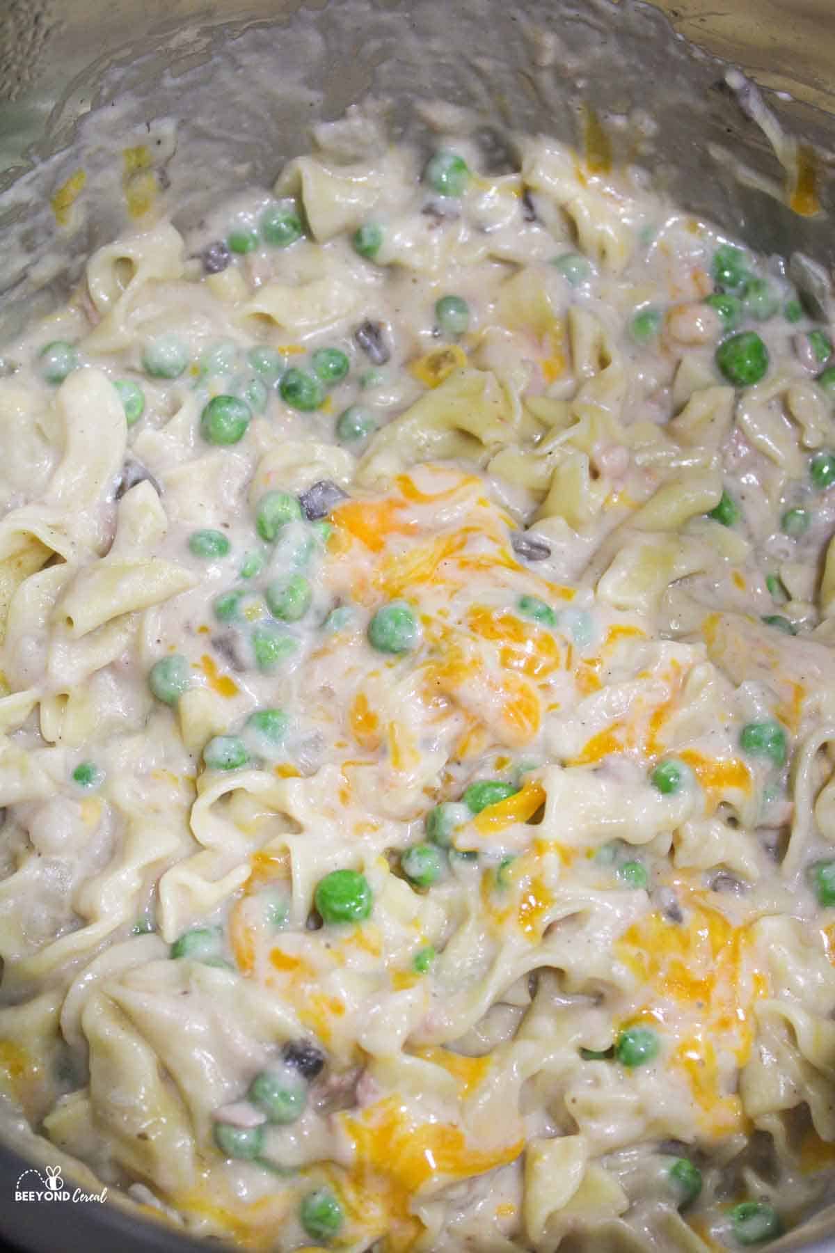 cheesy pea filled tuna noodle casserole in an instant pot