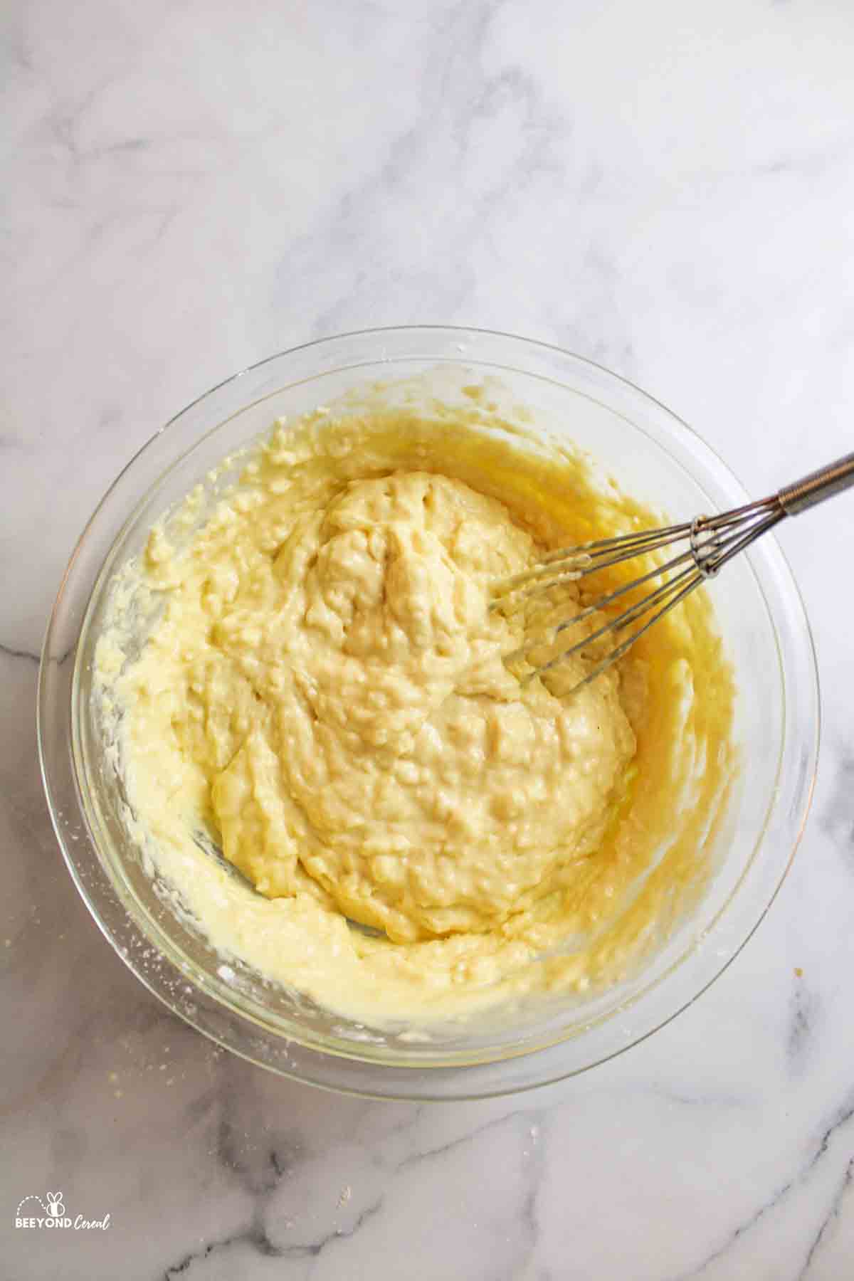 lumpy pancake batter and whisk in mixing bowl.