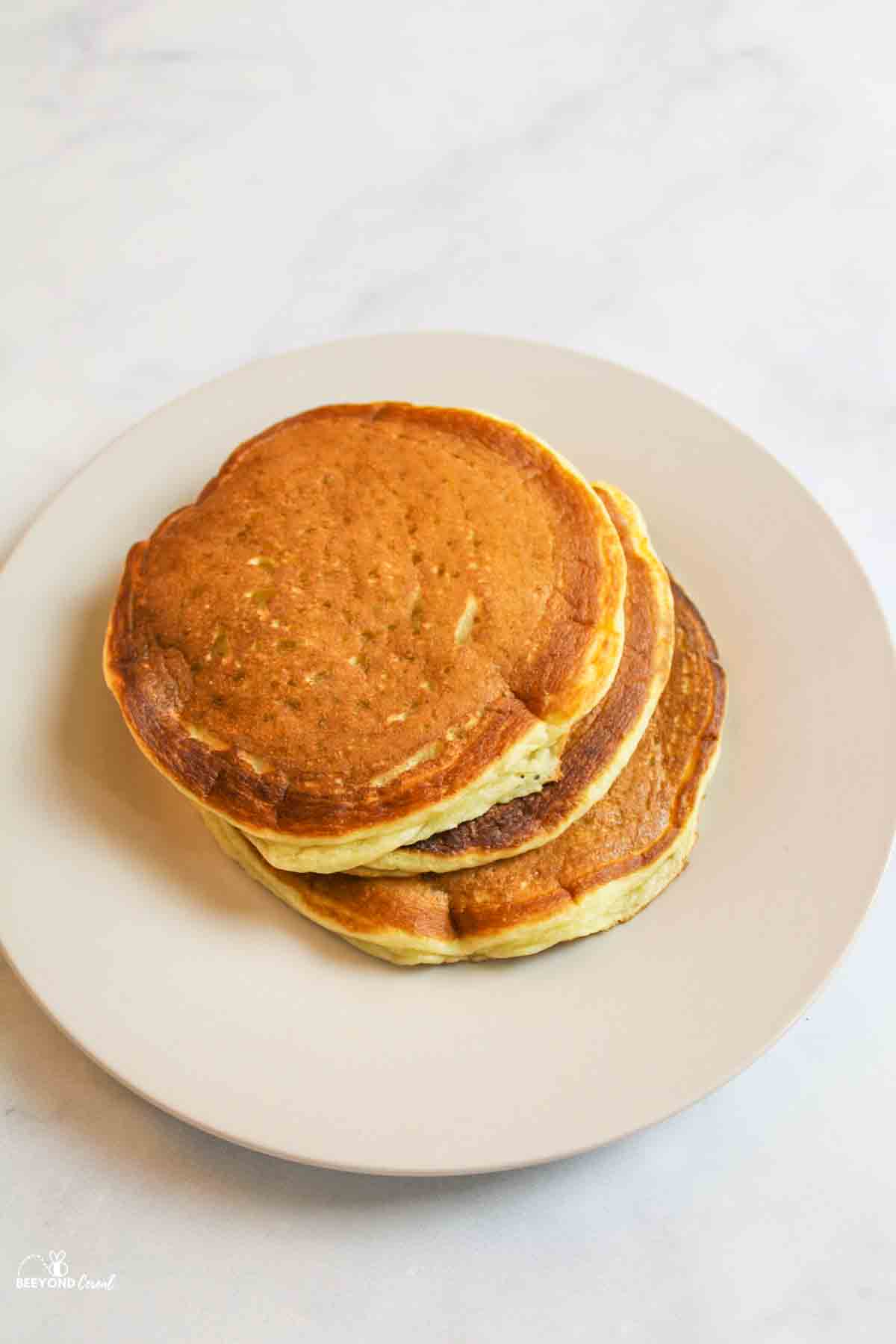 cooked pancakes on a plate.