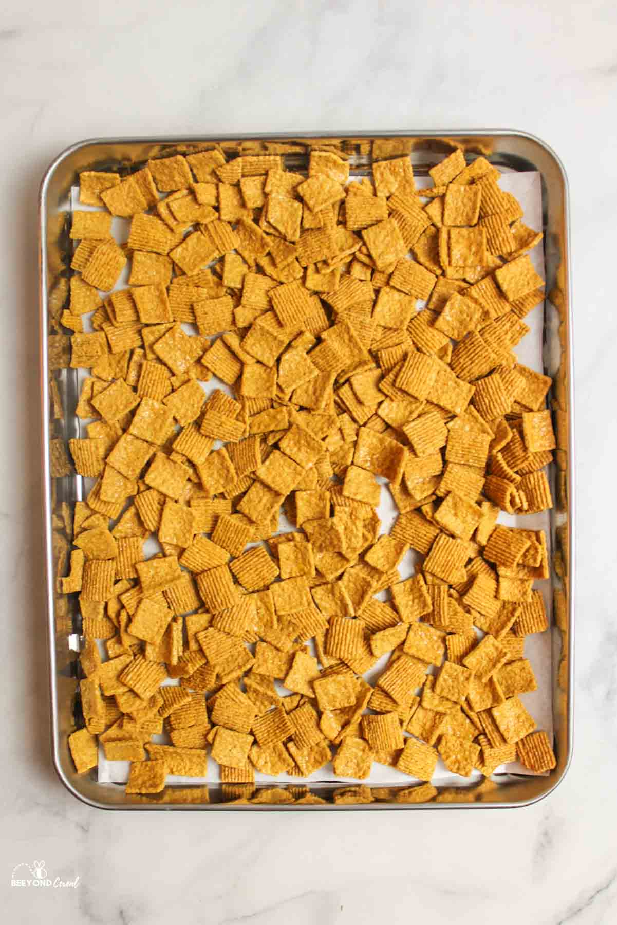 golden graham cereal on a baking sheet