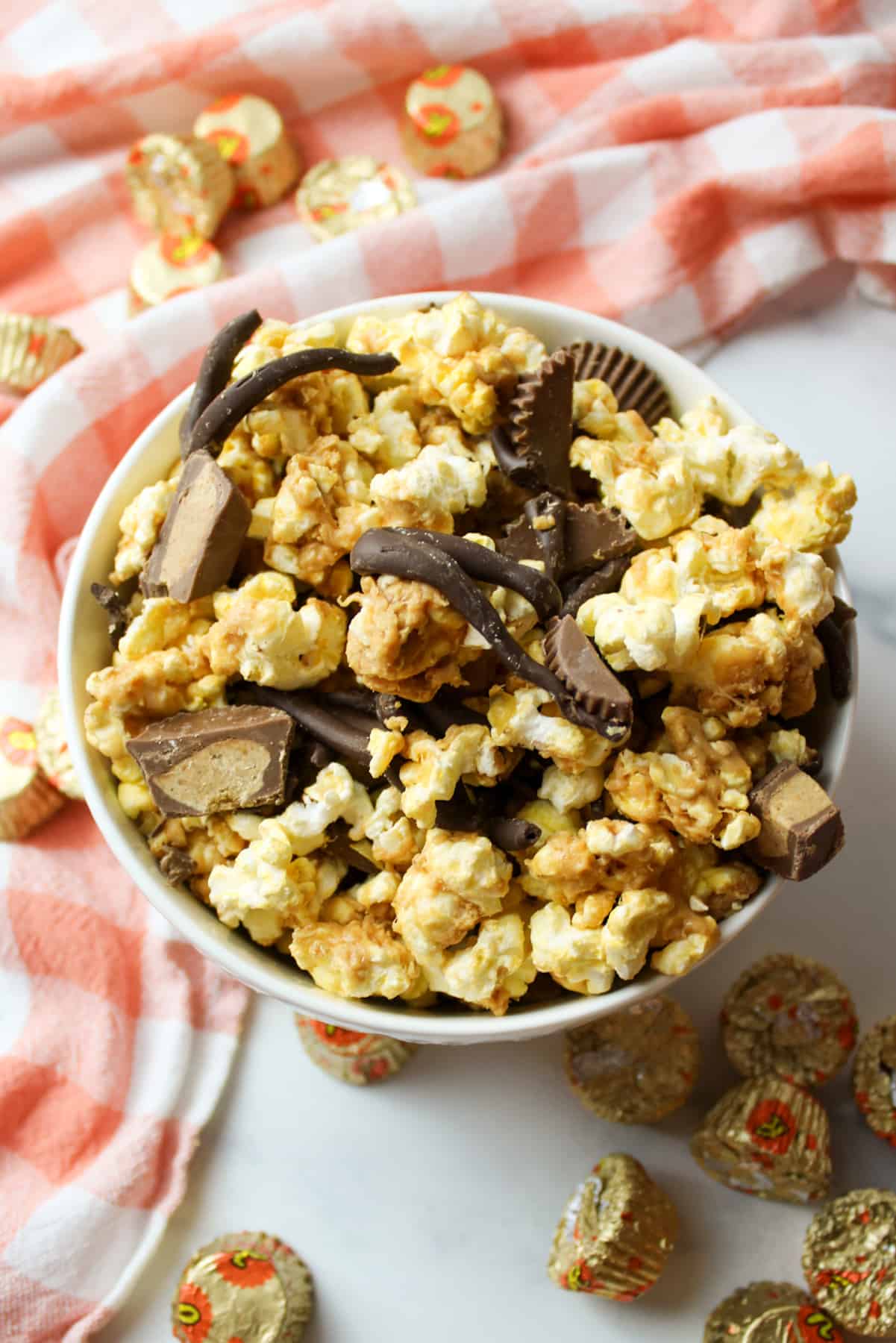 a bowl filled with chocolate peanut butter popcorn.