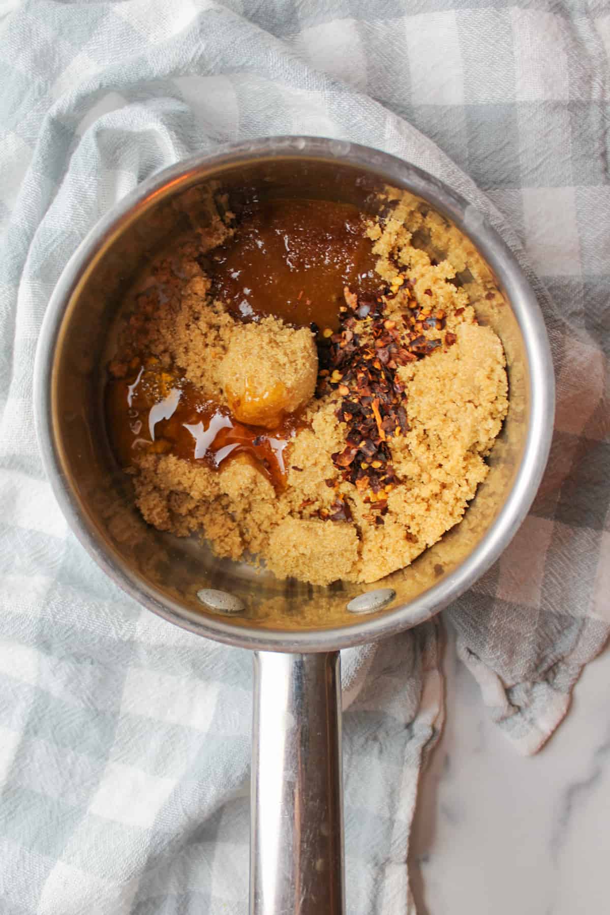 brown sugar honey vinegar and red pepper flakes in a pan