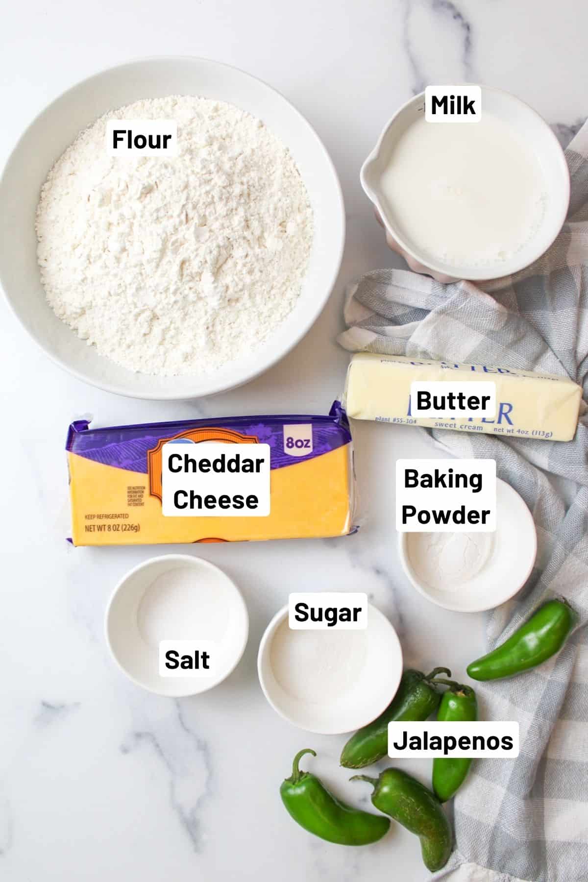 labeled ingredients needed to make jalapeno cheddar biscuits.