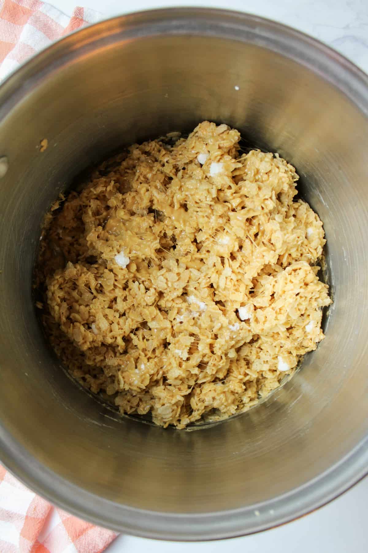 peanut butter rice krispie cereal mixture in a pot