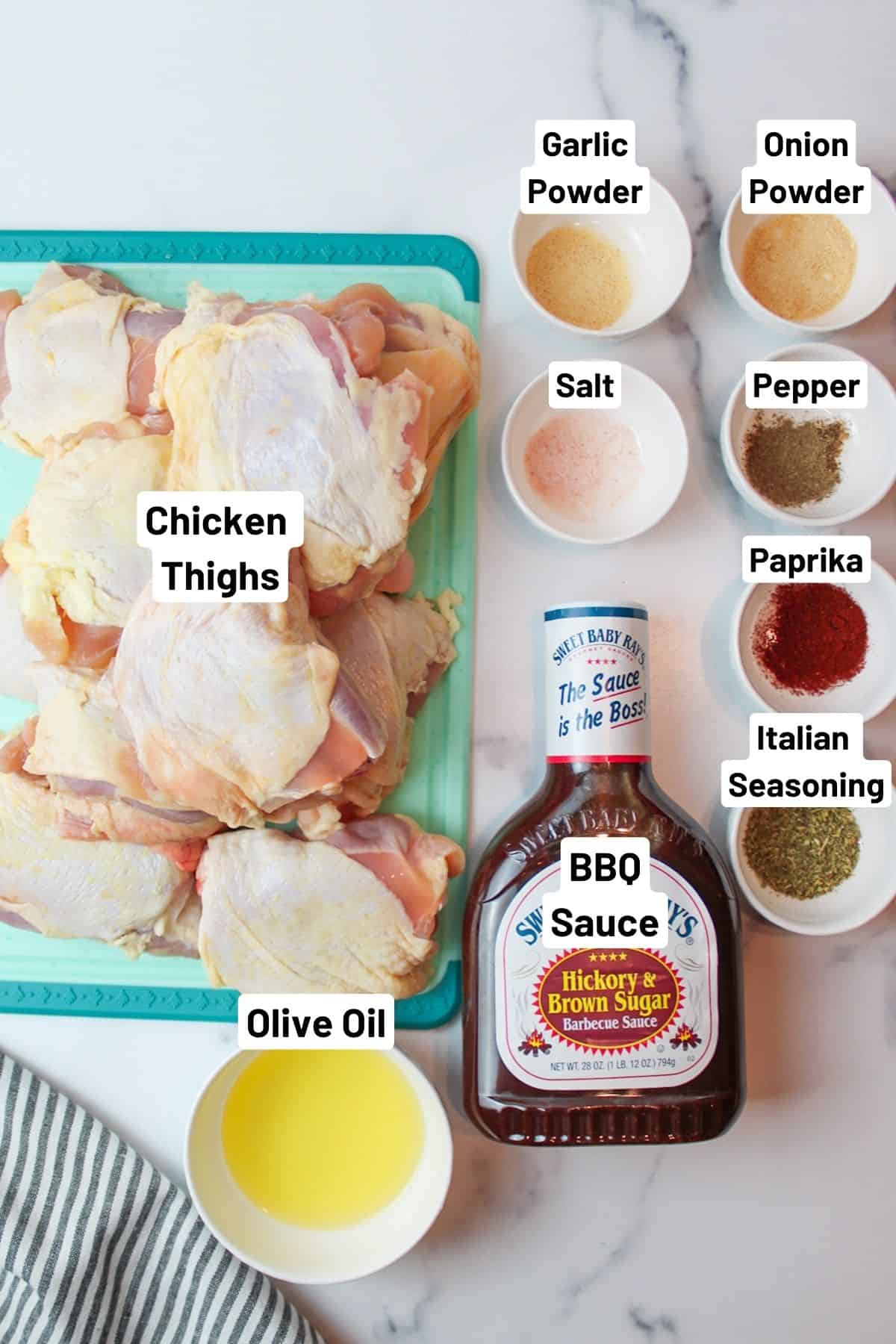 labeled ingredients needed to make baked bbq chicken thighs.