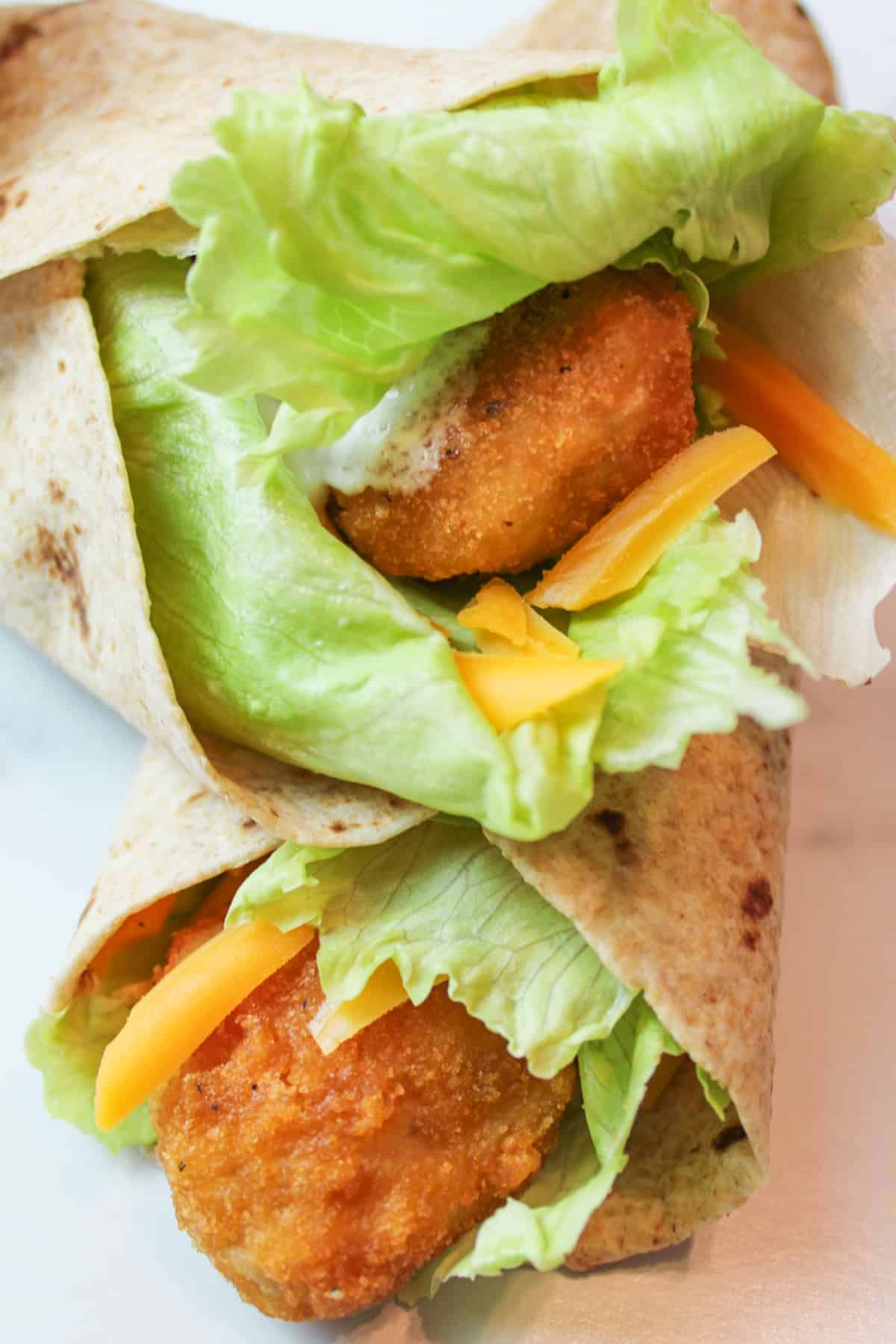 chicken nugget wraps stacked on eachother.