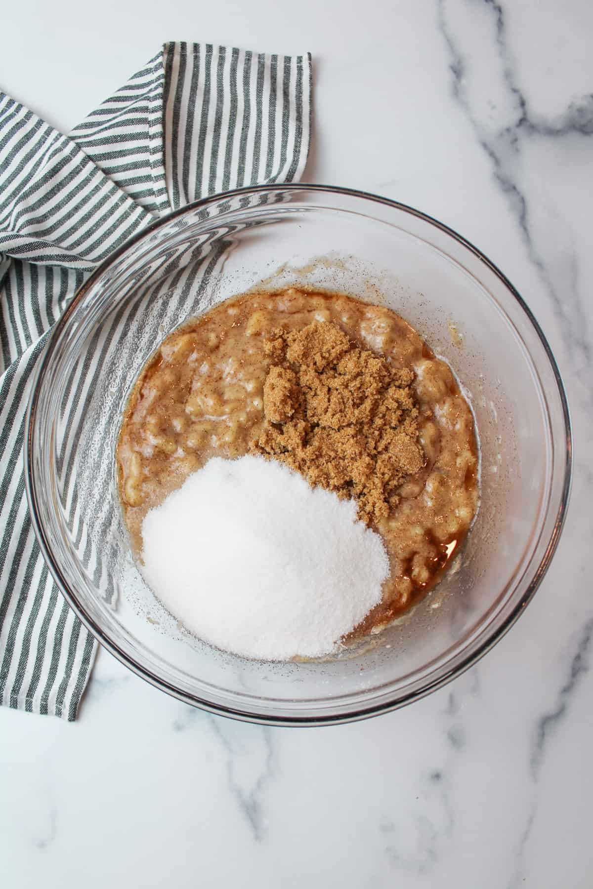 wet cinnamon banana mixture in a mixing bowl.