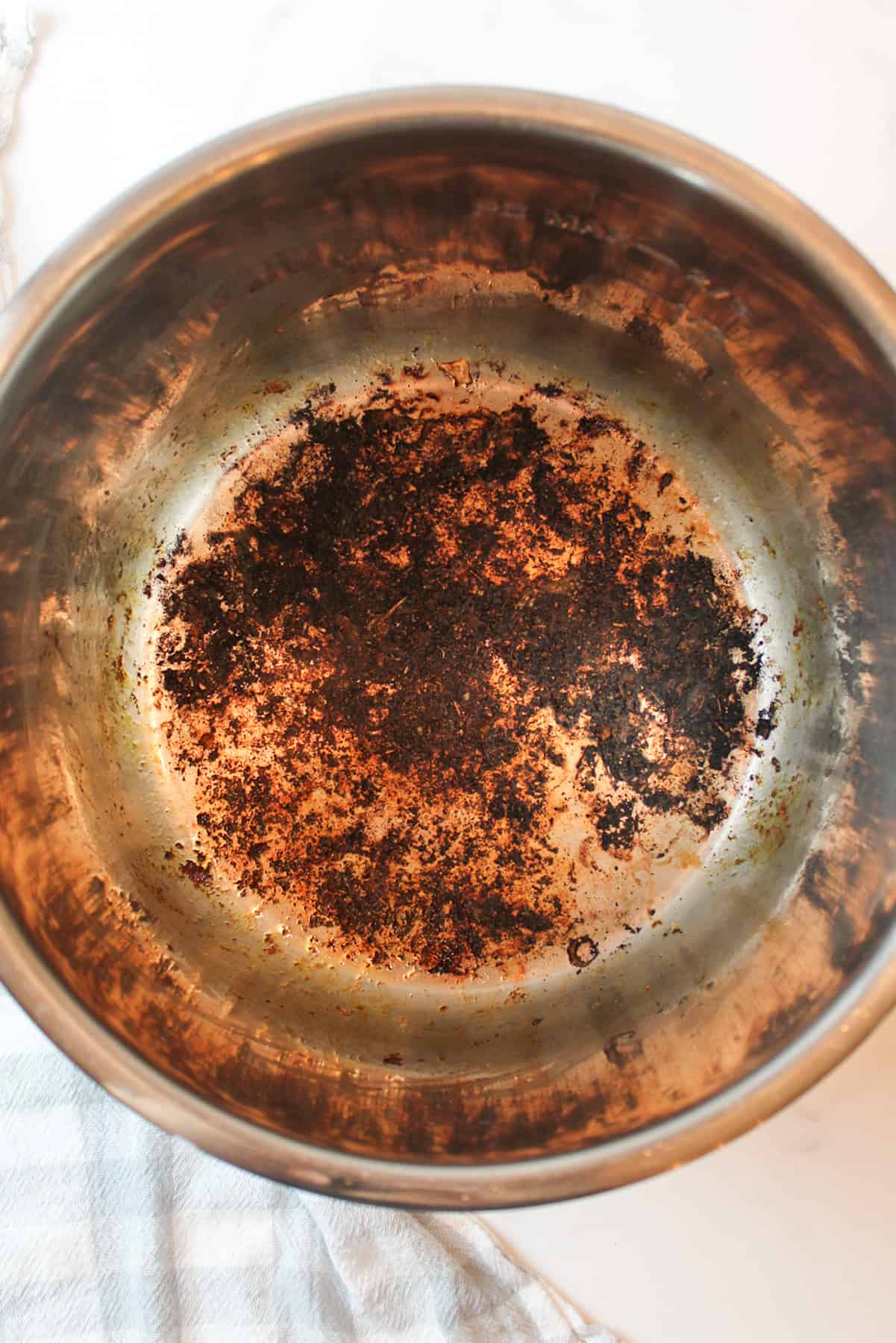 burnt bits at the bottom of the instant pot liner.