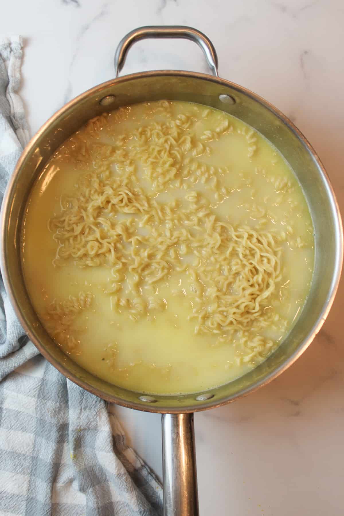 cooked ramen in a large pan.