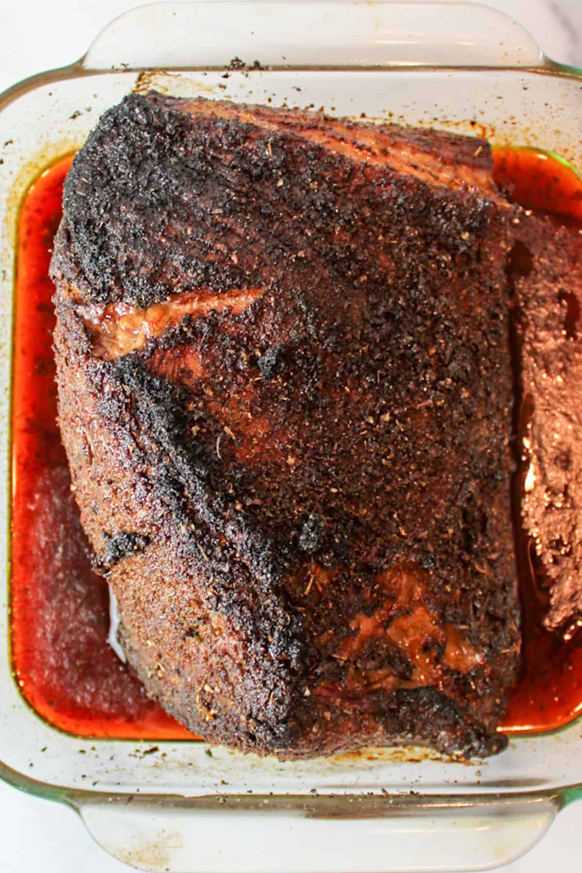 cooked beef roast in a roasting pan.