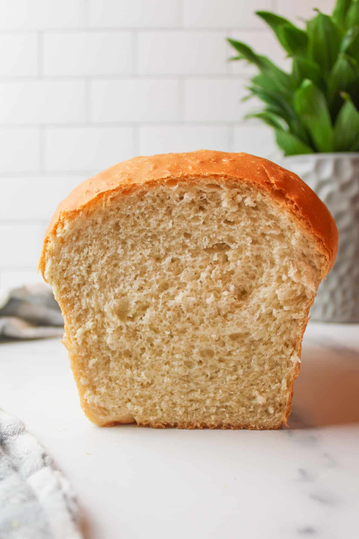 a loaf of white bread that has been sliced open to reveal the soft crumb inside