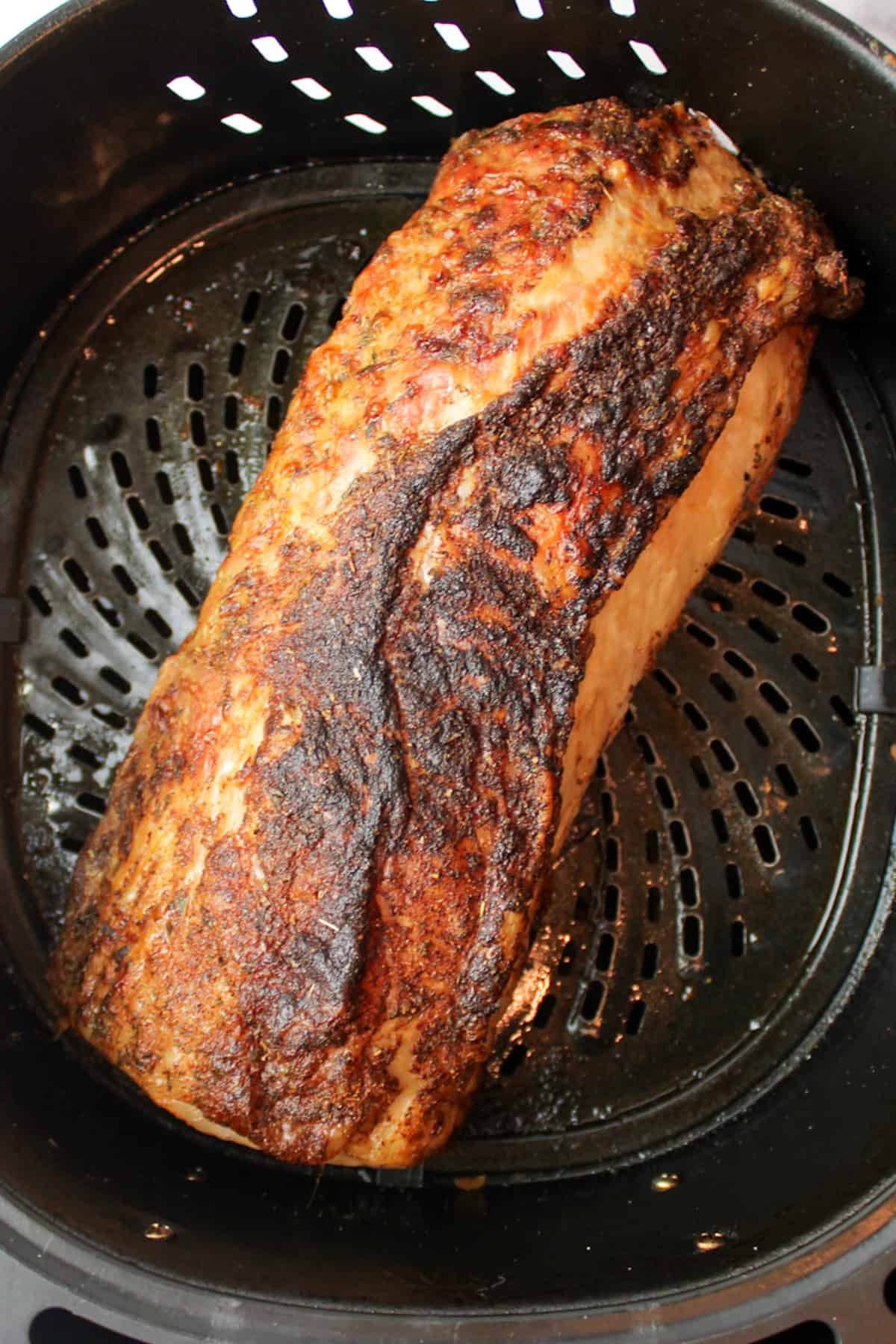 air fried pork loin in an air fryer basket