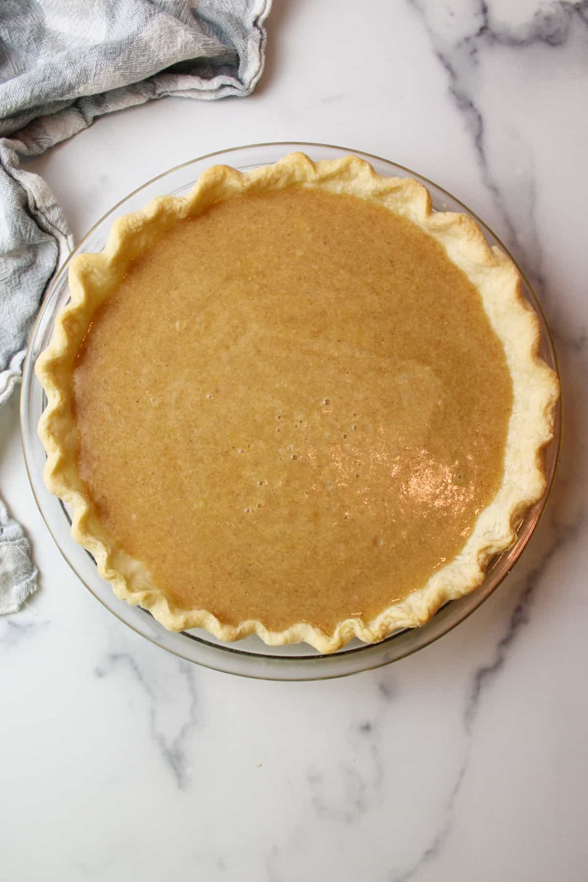 applesauce custard pie filling in a prebaked pie crust