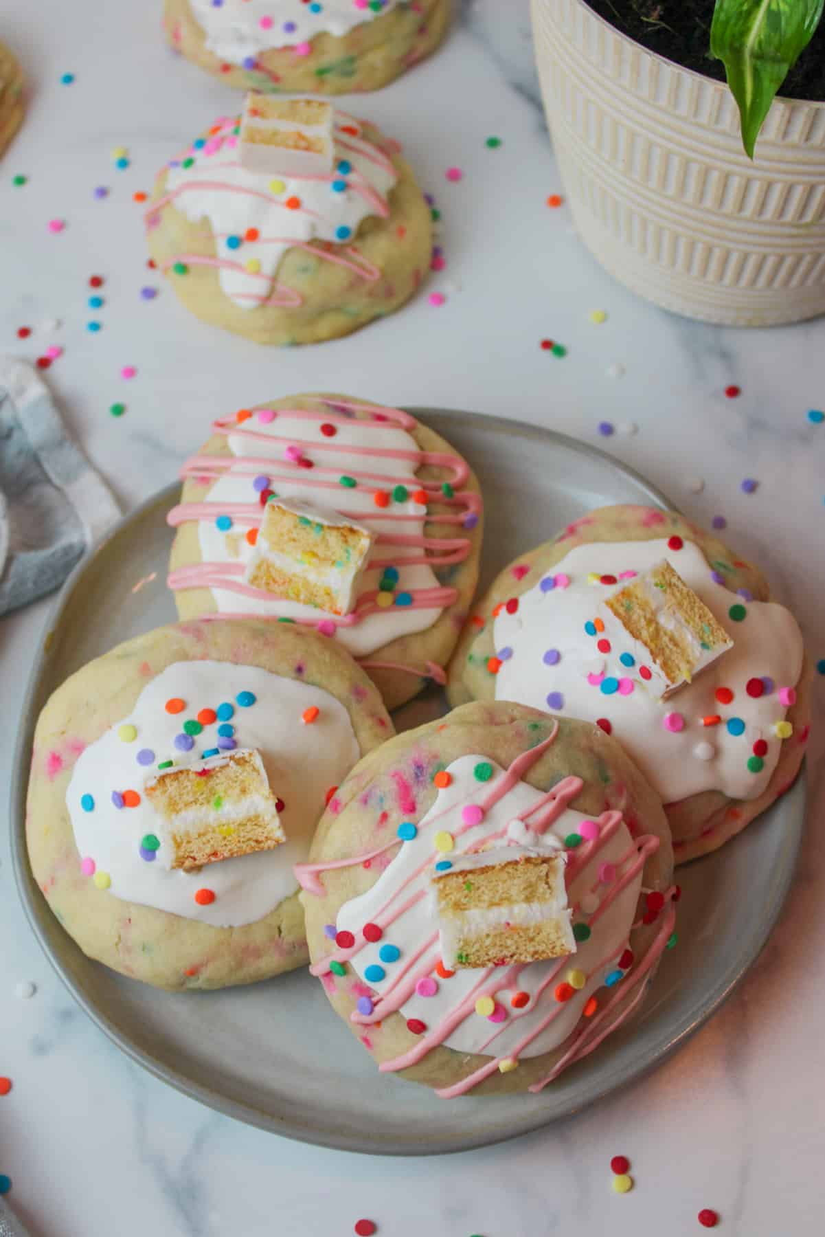 aerial view of a plate topped with birthday cake stuffed cookies