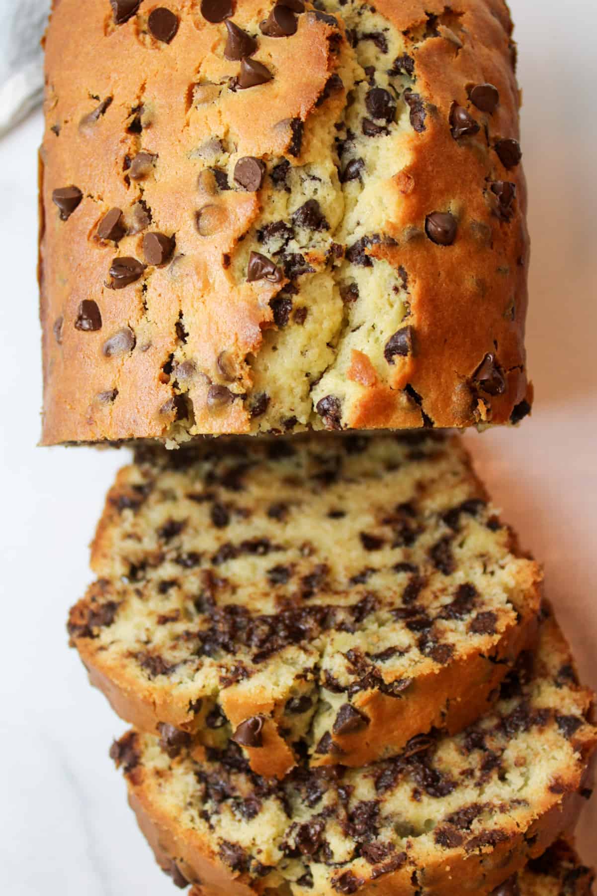 a sliced loaf of chocolate chip cake.