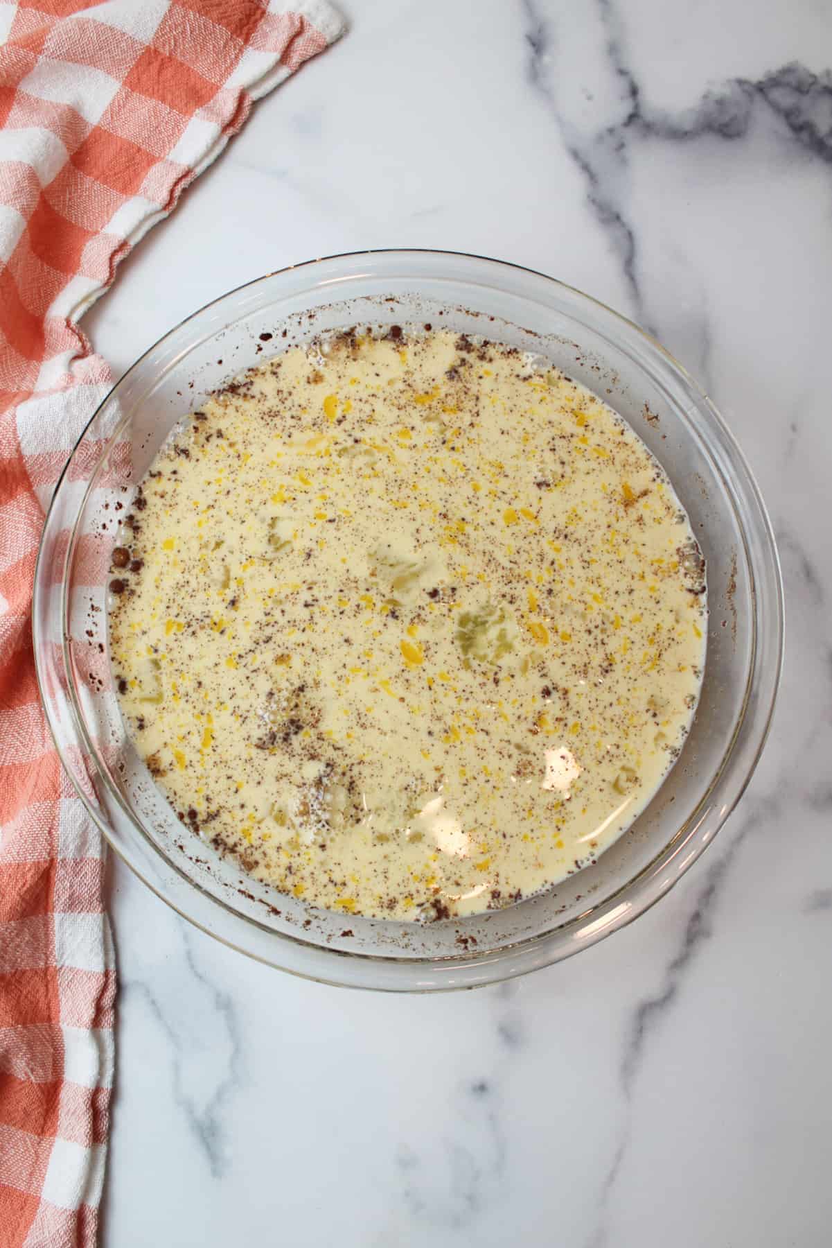 french toast egg mixture in a pie plate