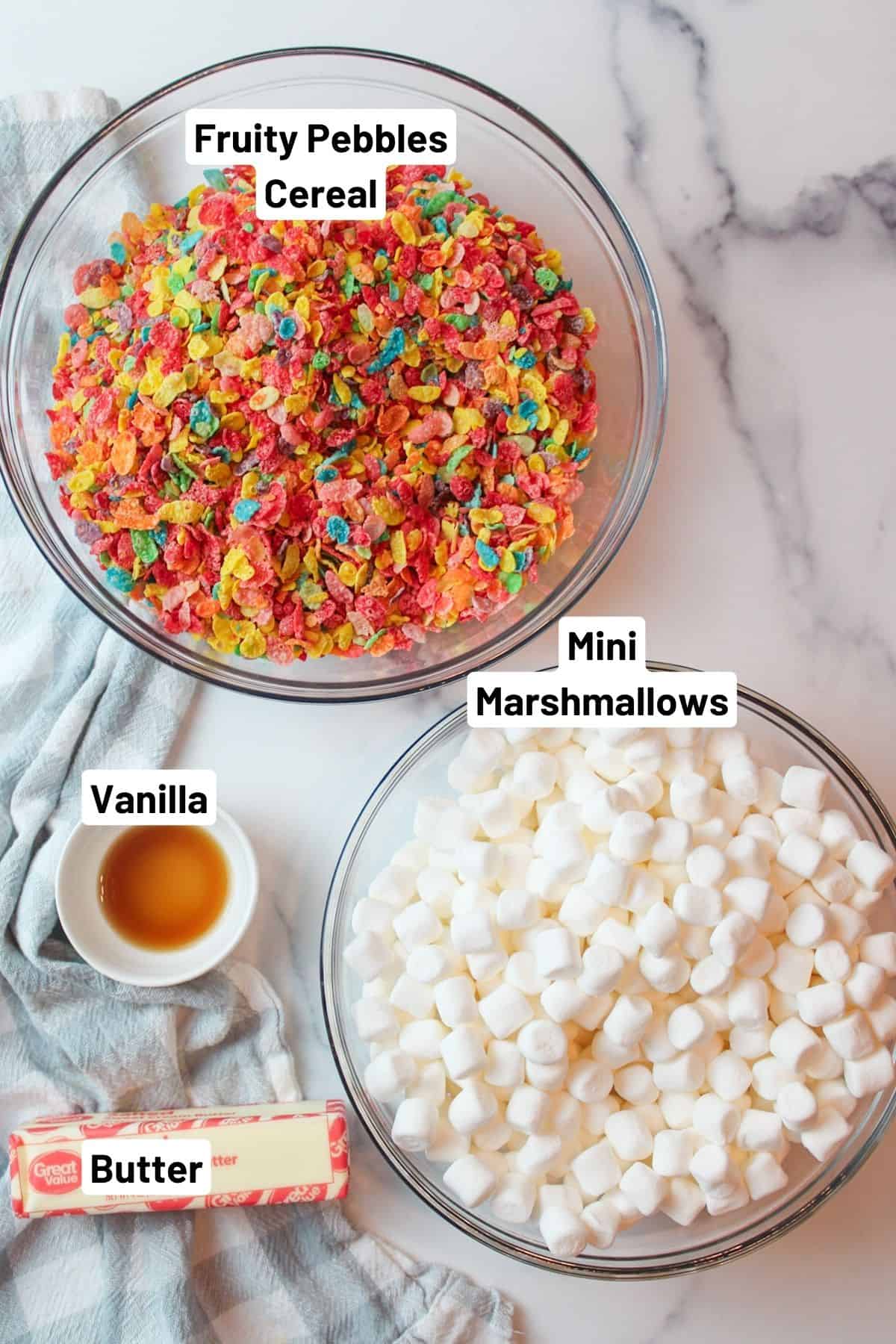 labled ingredients needed to make fruity pebbles treats.