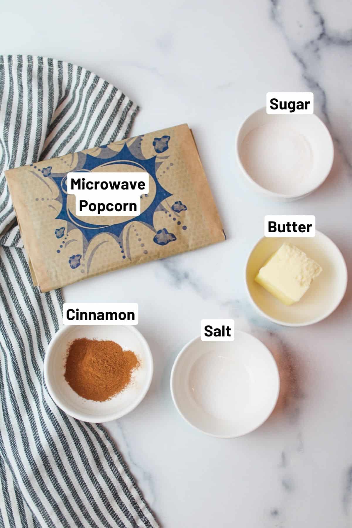 labeled ingredients needed to make snickerdoodle popcorn