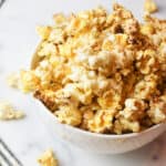 snickerdoodle popcorn in a white bowl.