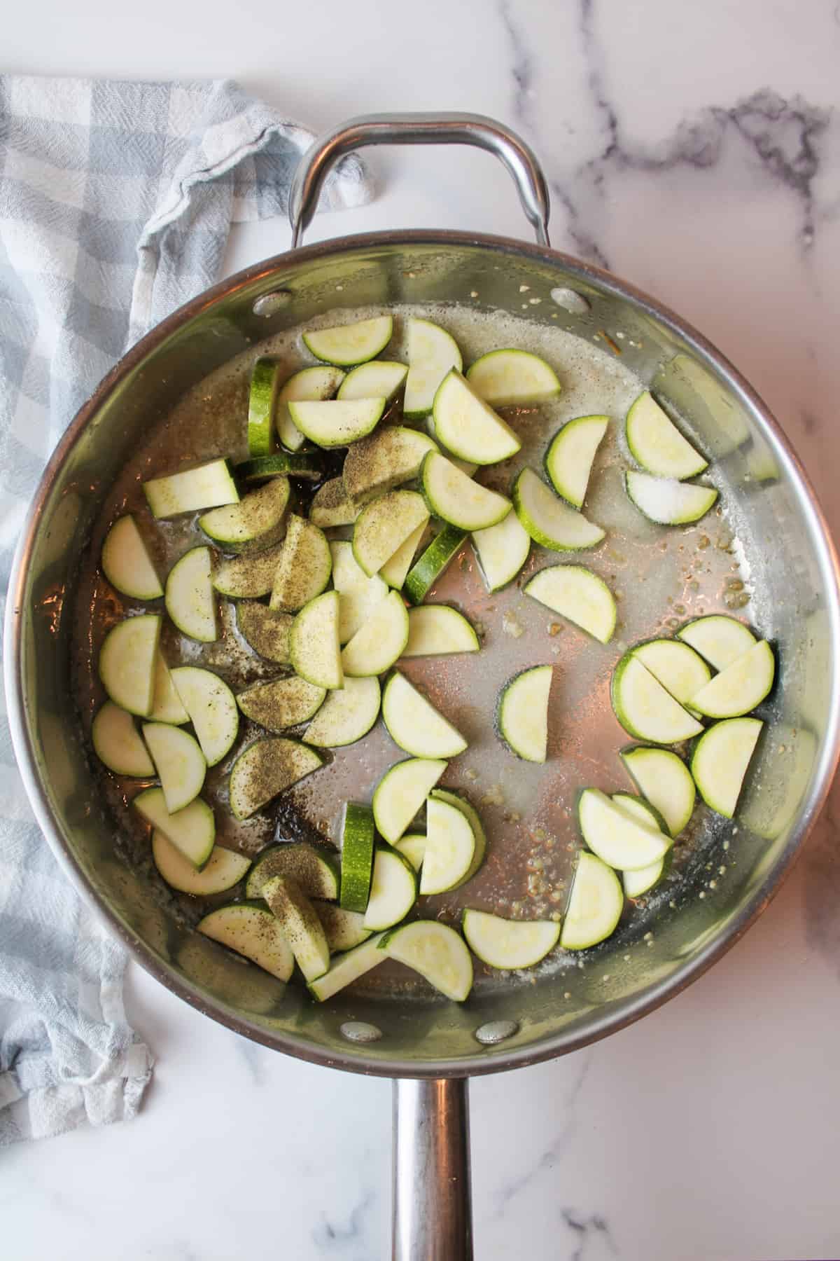 chopped zucchini and salt and pepper in a pot with minced garlic and melted butter.