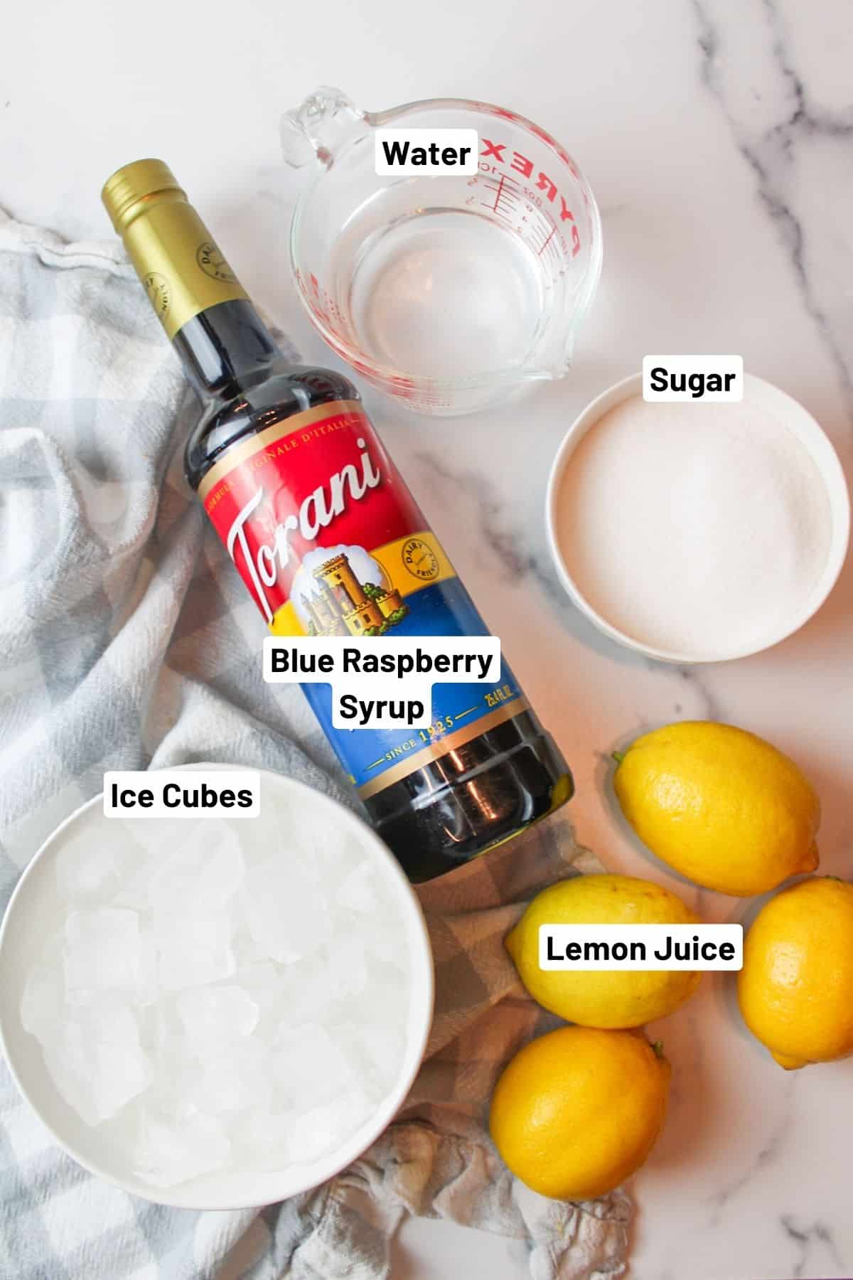 labeled ingredients needed to make blue raspberry lemonade.