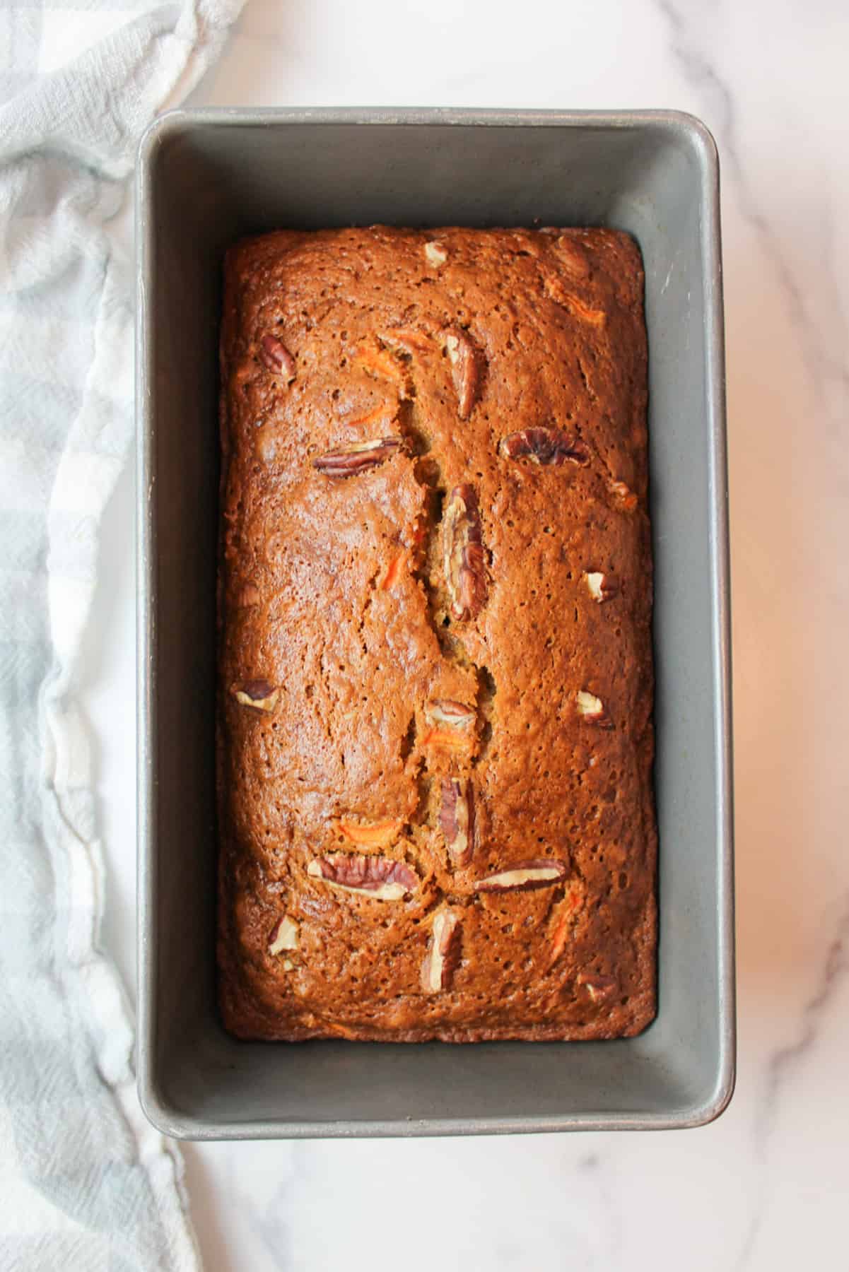 baked carrot cake banana bread in a loaf pan