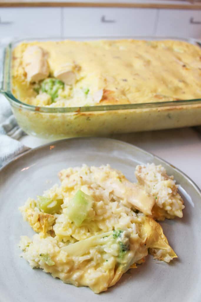 chicken rice broccoli casserole in a baking dish and a plate
