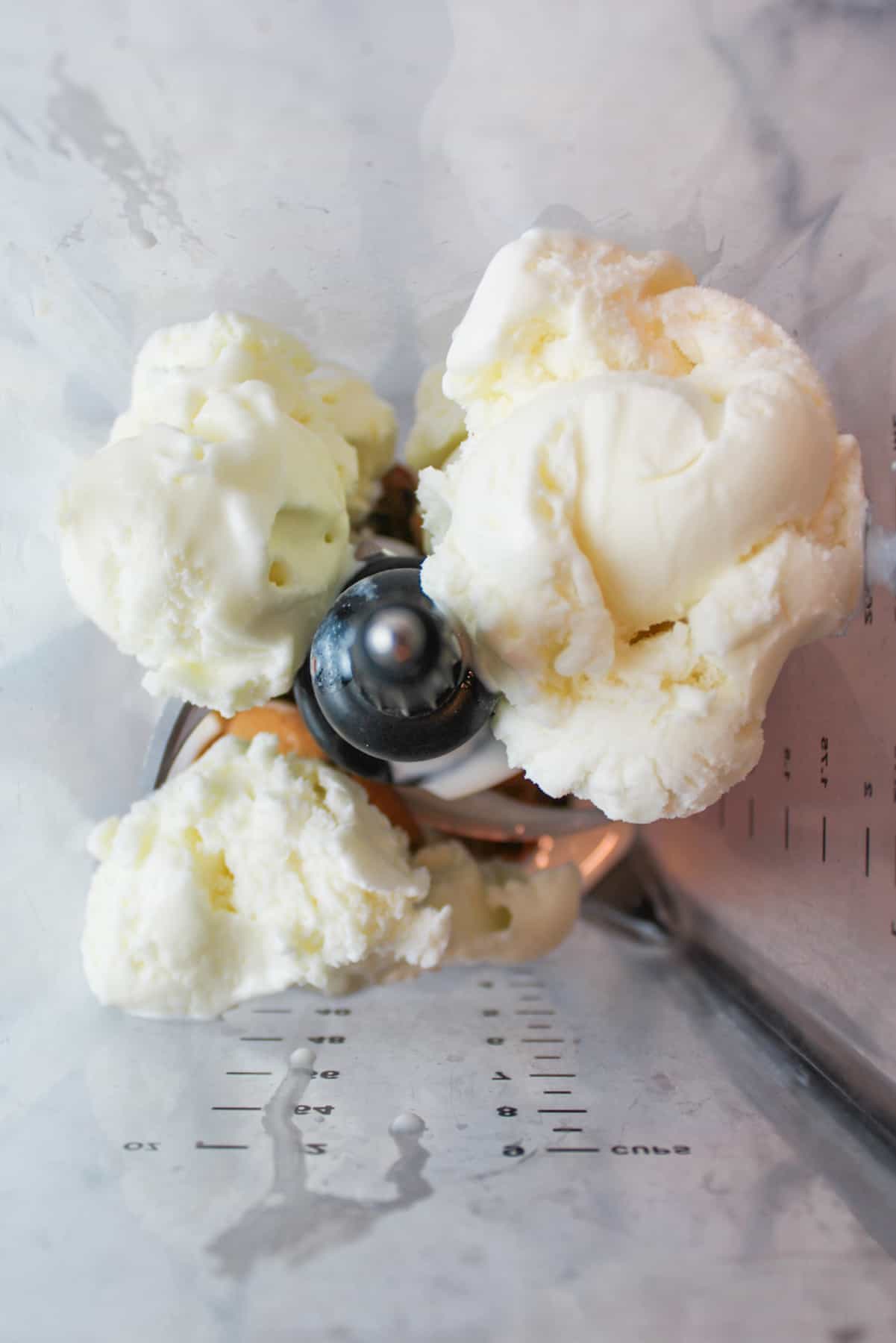 vanilla ice cream inside of a blender.