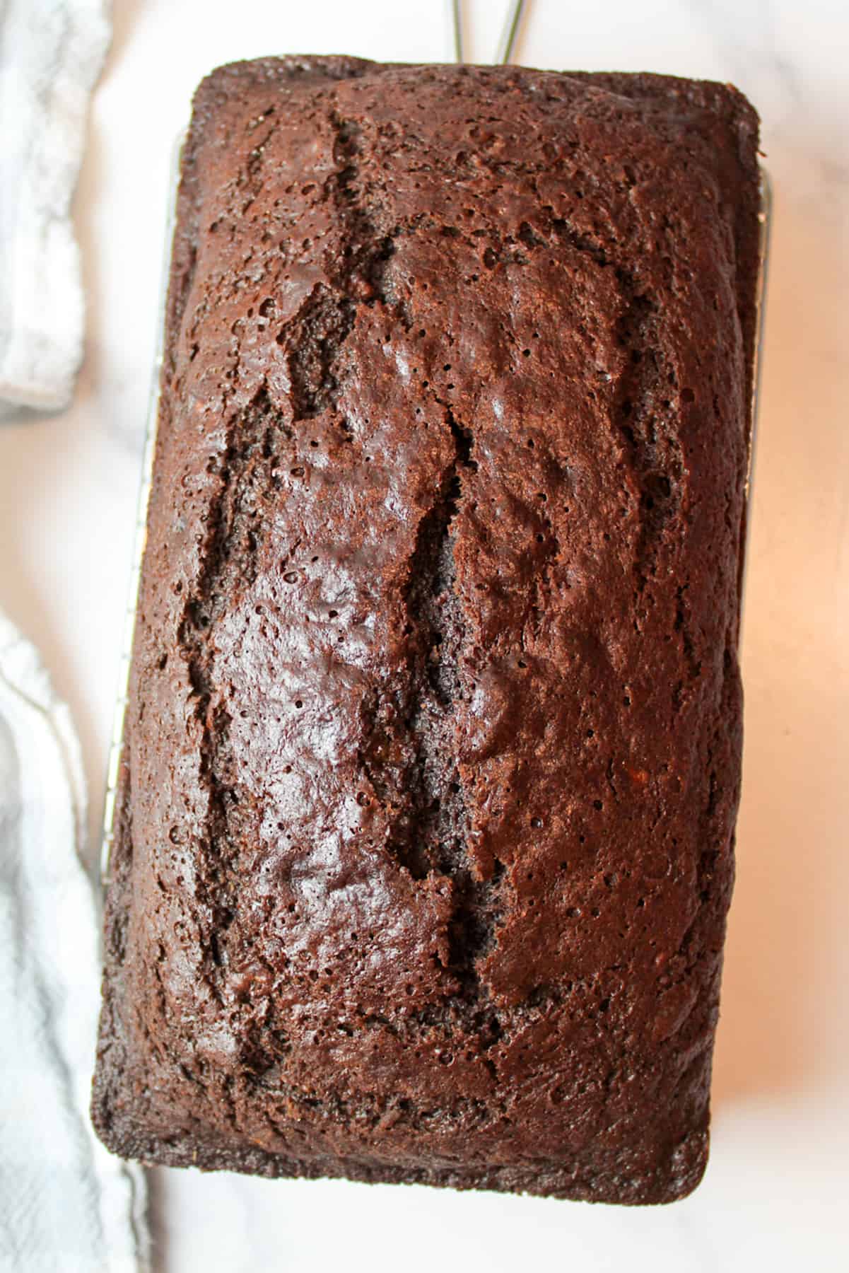 aerial view of chocolate orange loaf on a wire rack