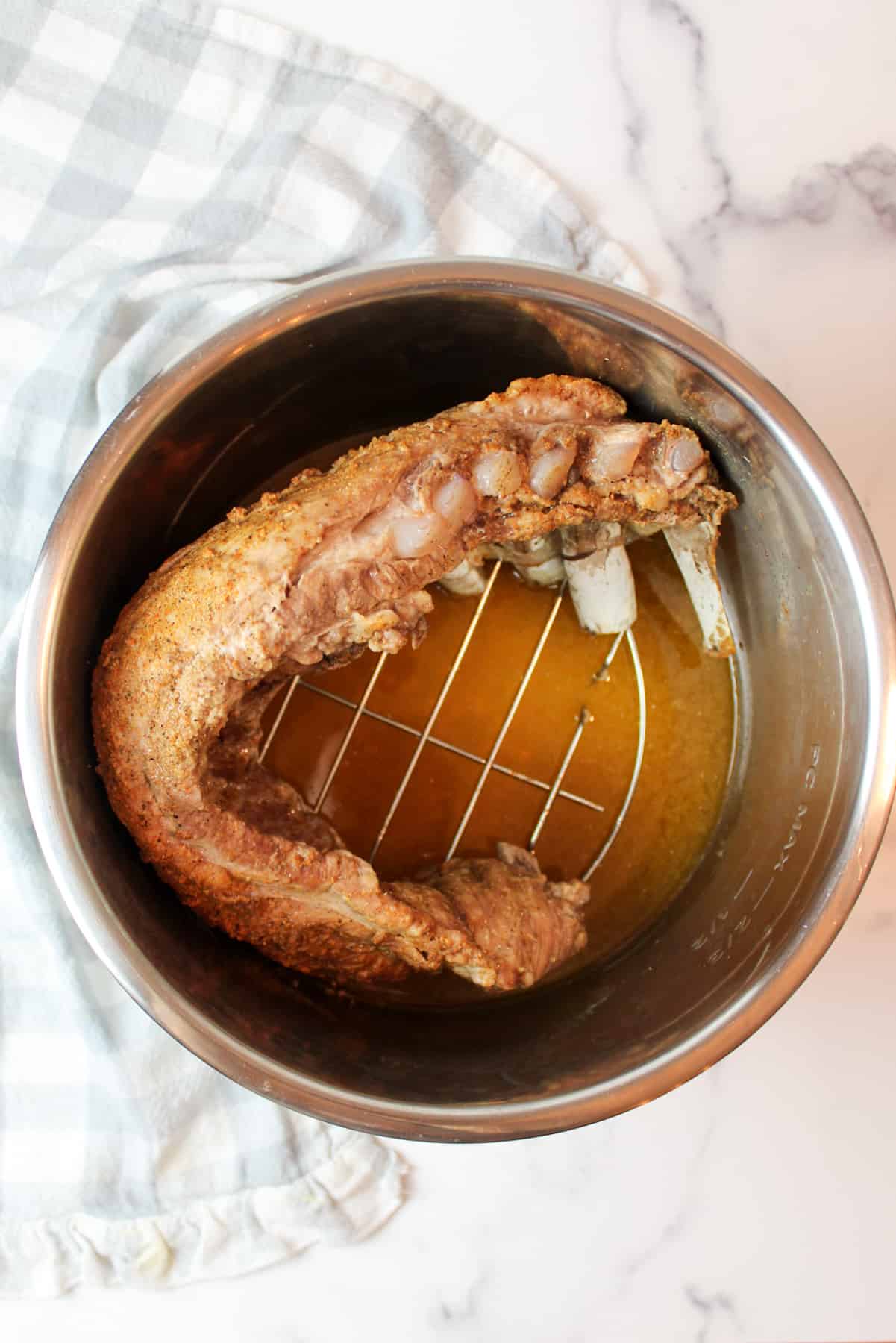 instant pot with trivet and cooked ribs inside