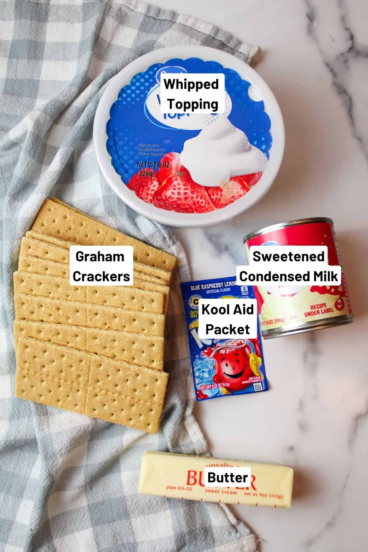 ingredients needed to make kool aid pie. Whipped topping, graham crust, condensed milk and kool aid packet