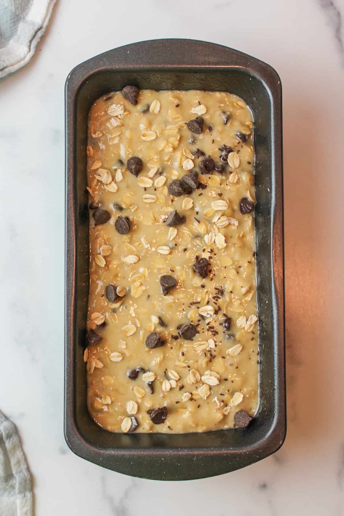 oatmeal chocolate chip banana bread in a loaf pan