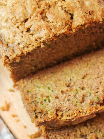 a close angled view of sliced zucchini bread