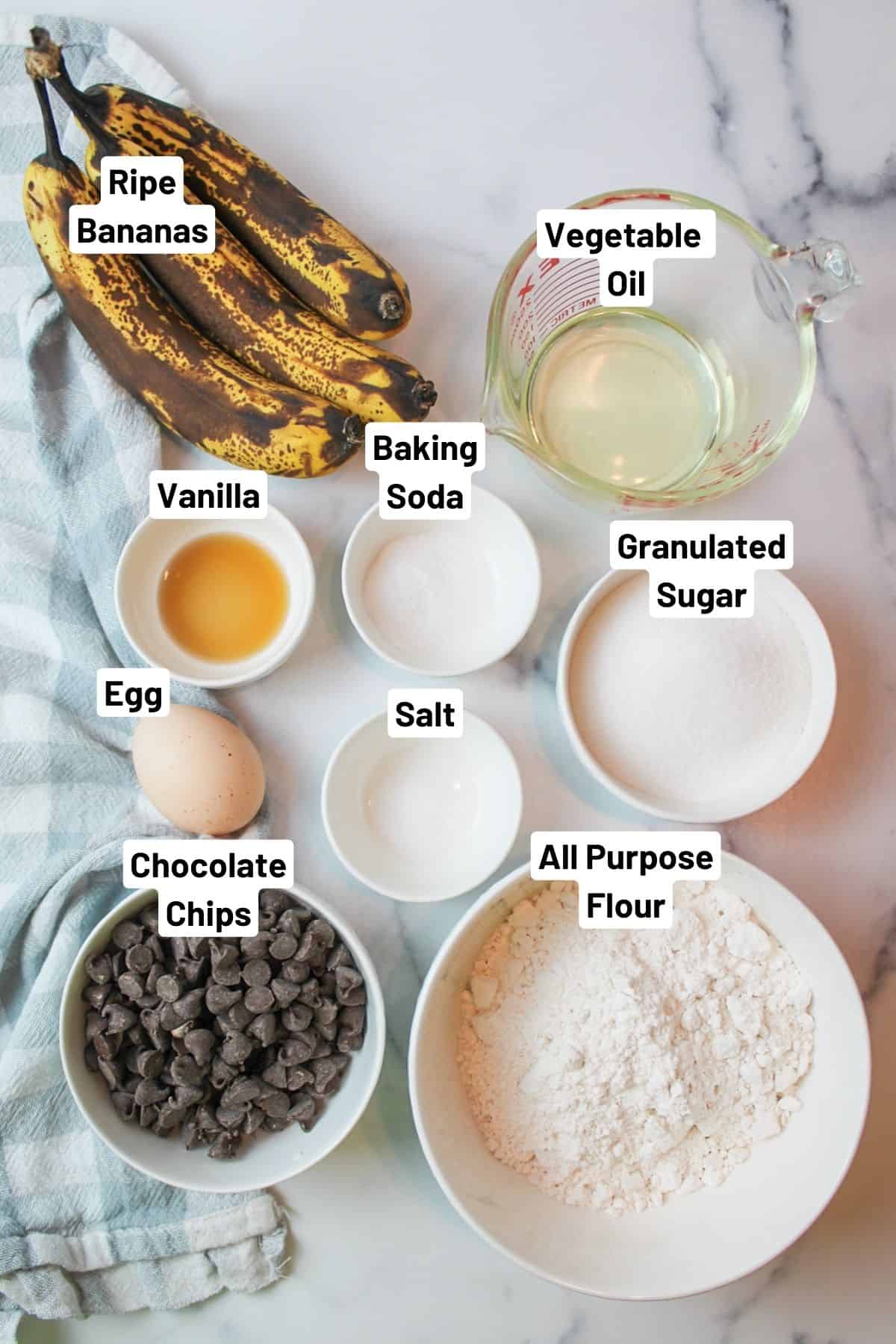 labeled ingredients needed to make one bowl chocolate chip banana bread.
