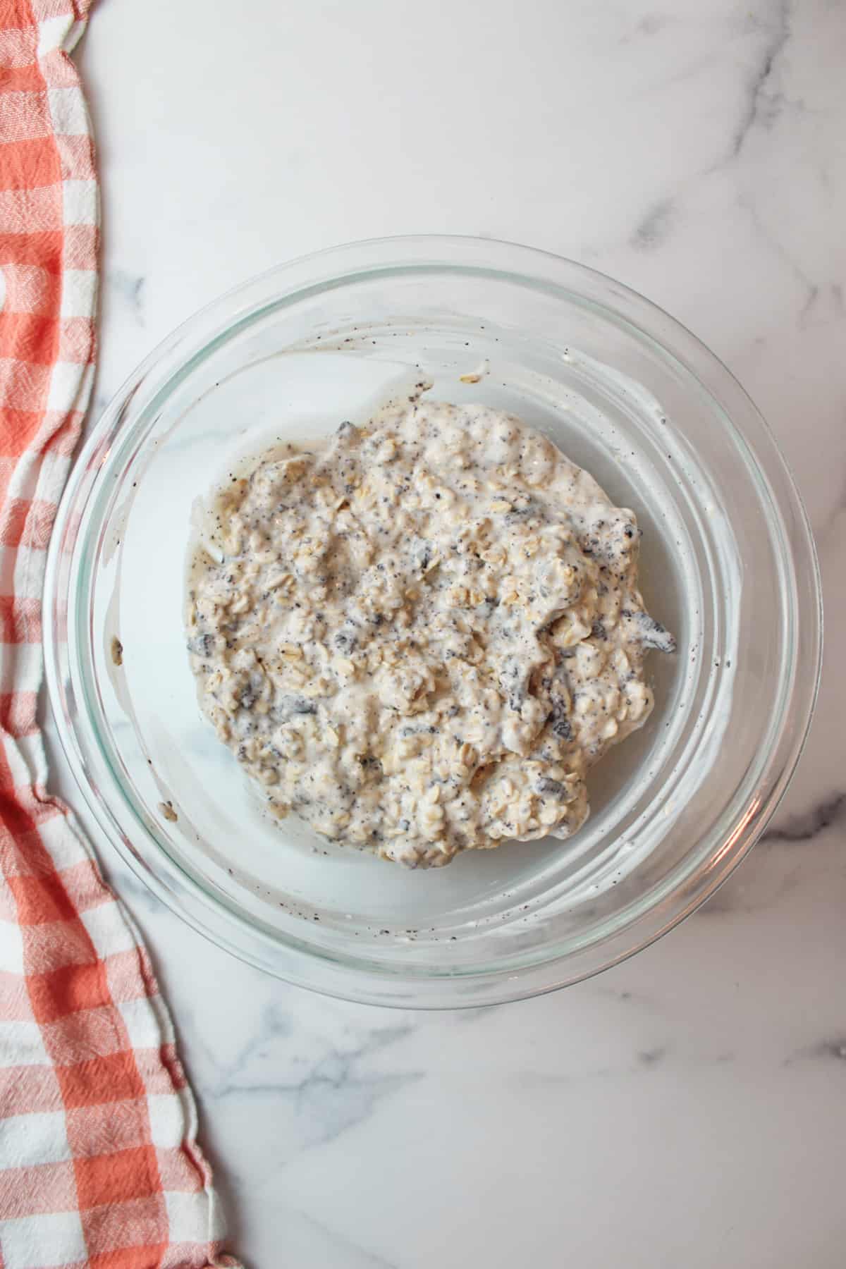 oreo overnight oats mixture in a mixing bowl