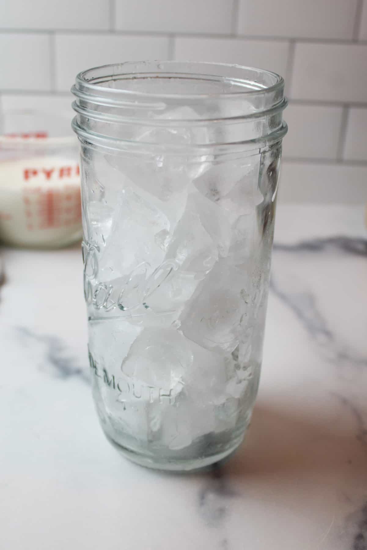 ice cubes in a tall glass cup.