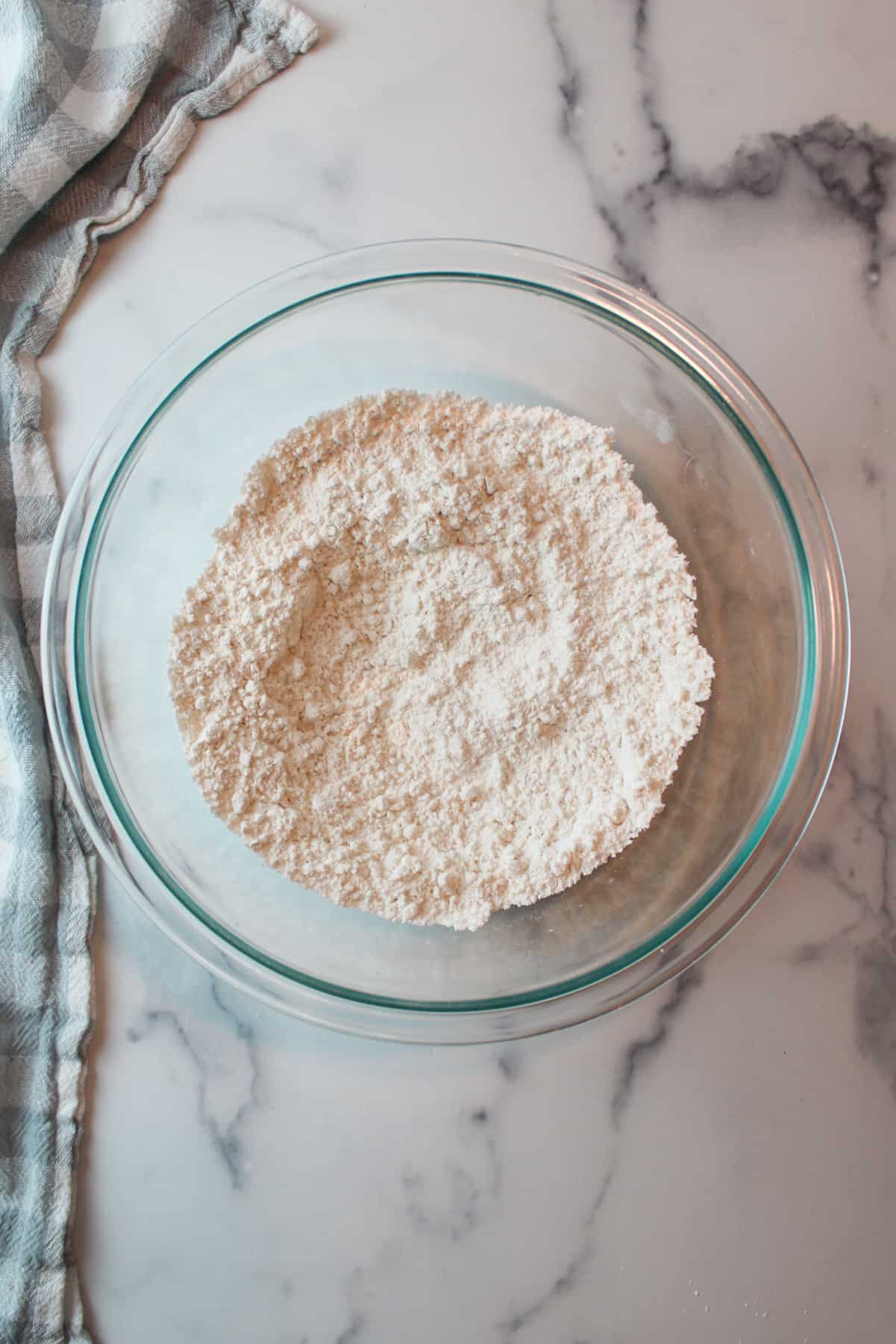 whisked dry ingredients for cookies in a mixing bowl.