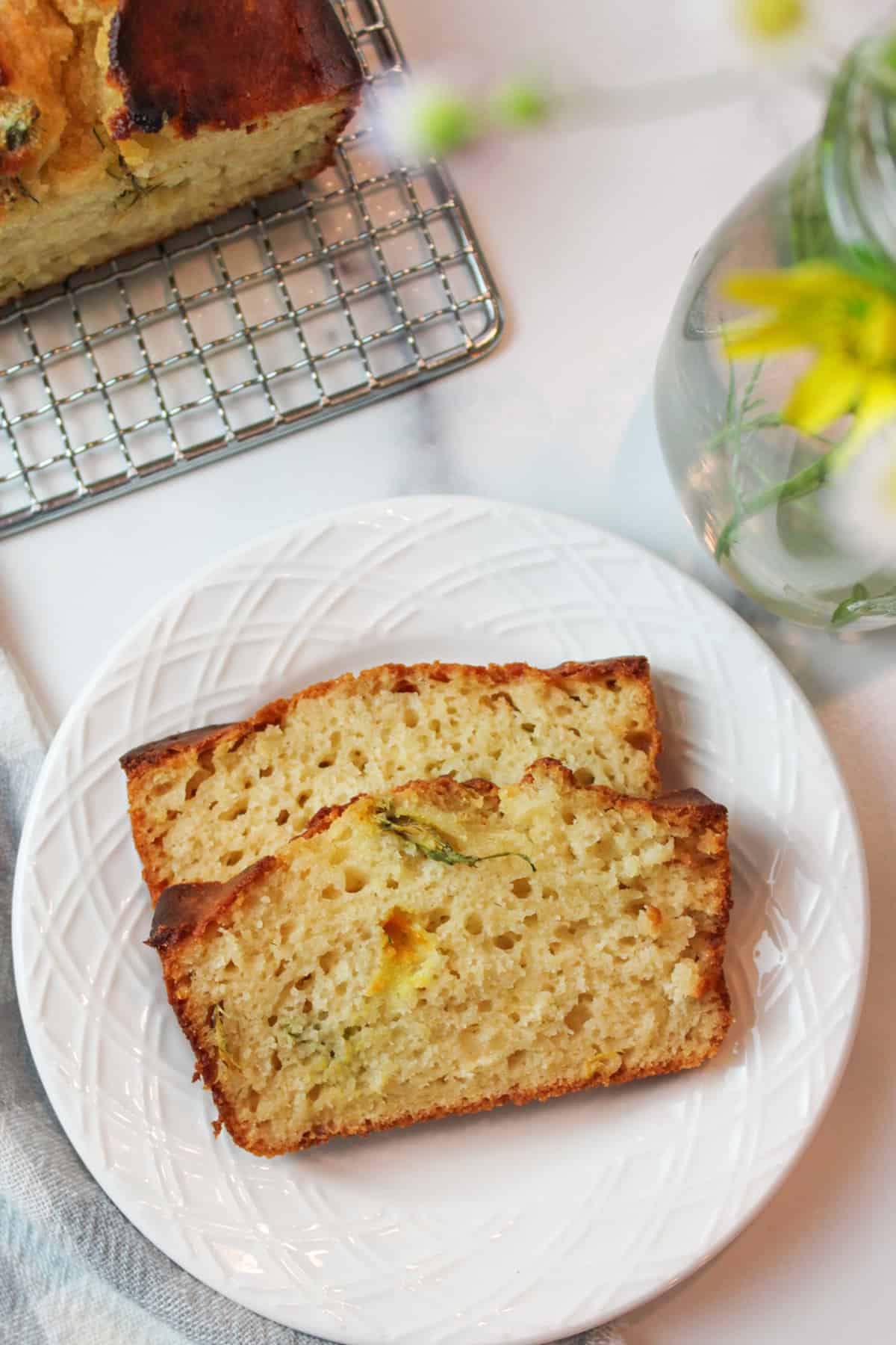 two slices of dandelion bread on a plate.