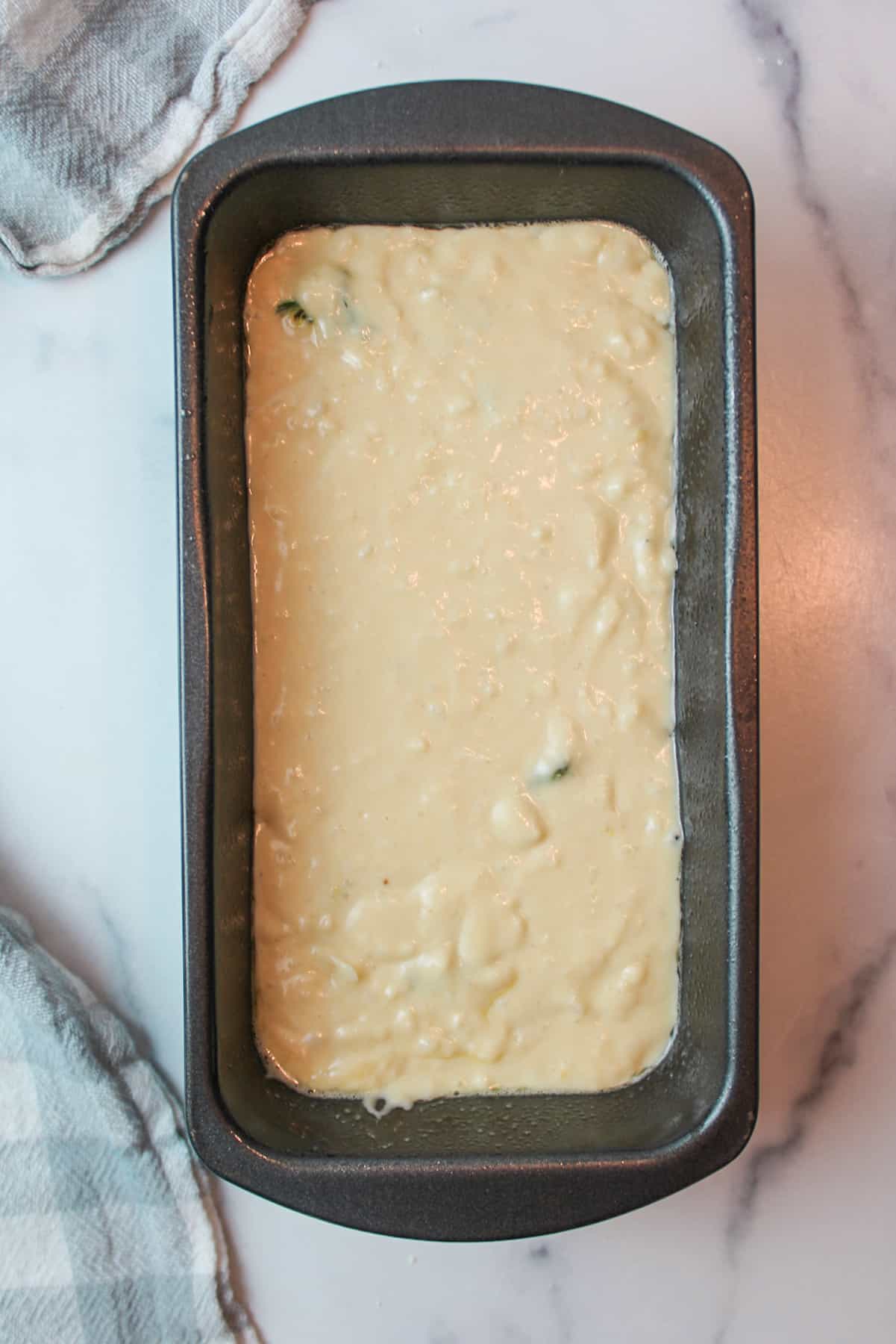 honey dandelion bread batter in an 8x4 bread loaf pan.