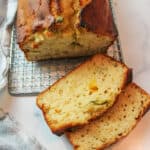 sliced dandelion honey quick bread on a wire rack.