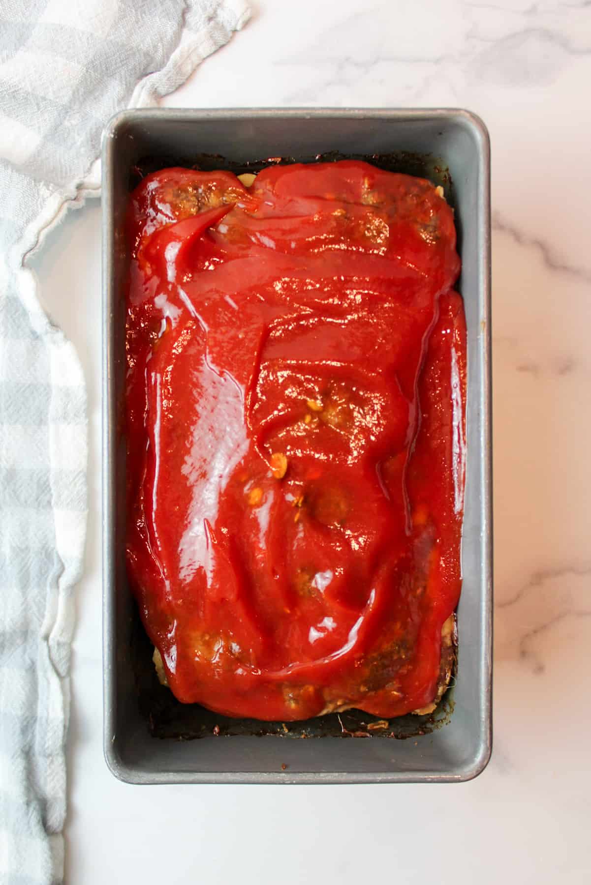 ketchup topped meatloaf in a loaf pan
