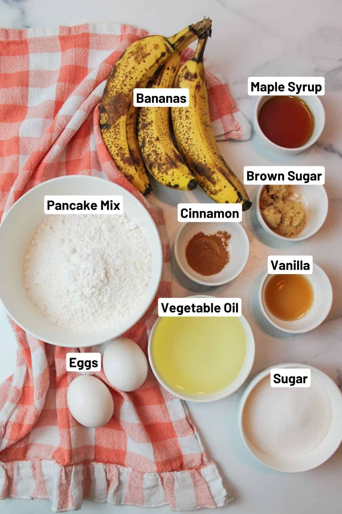 labeled ingredients needed to make banana bread with pancake mix.