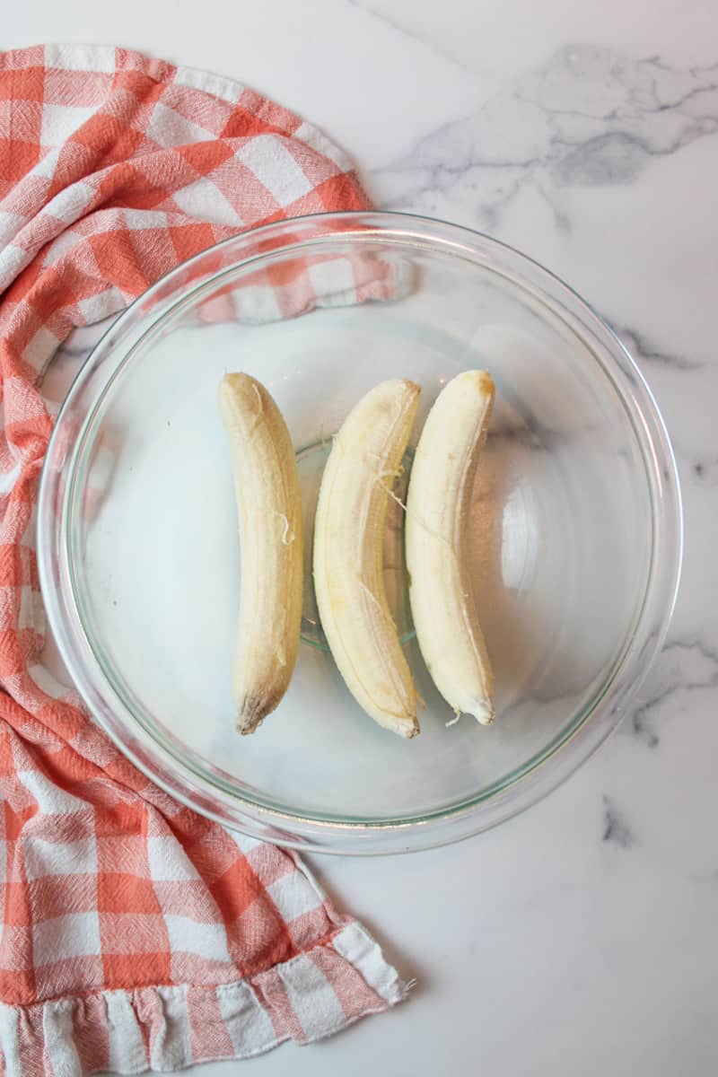 ripe peeled bananas in a mixing bowl