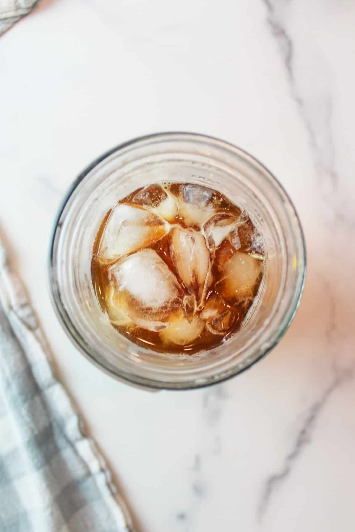 ice cubes and coffee in a glass cup.