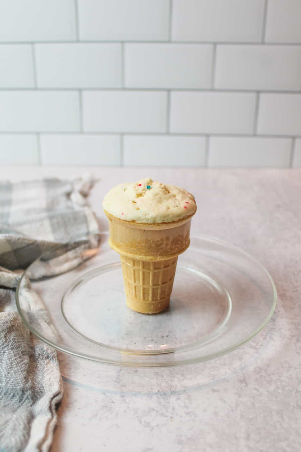 cooked microwave ice cream cone cupcake on a plate.