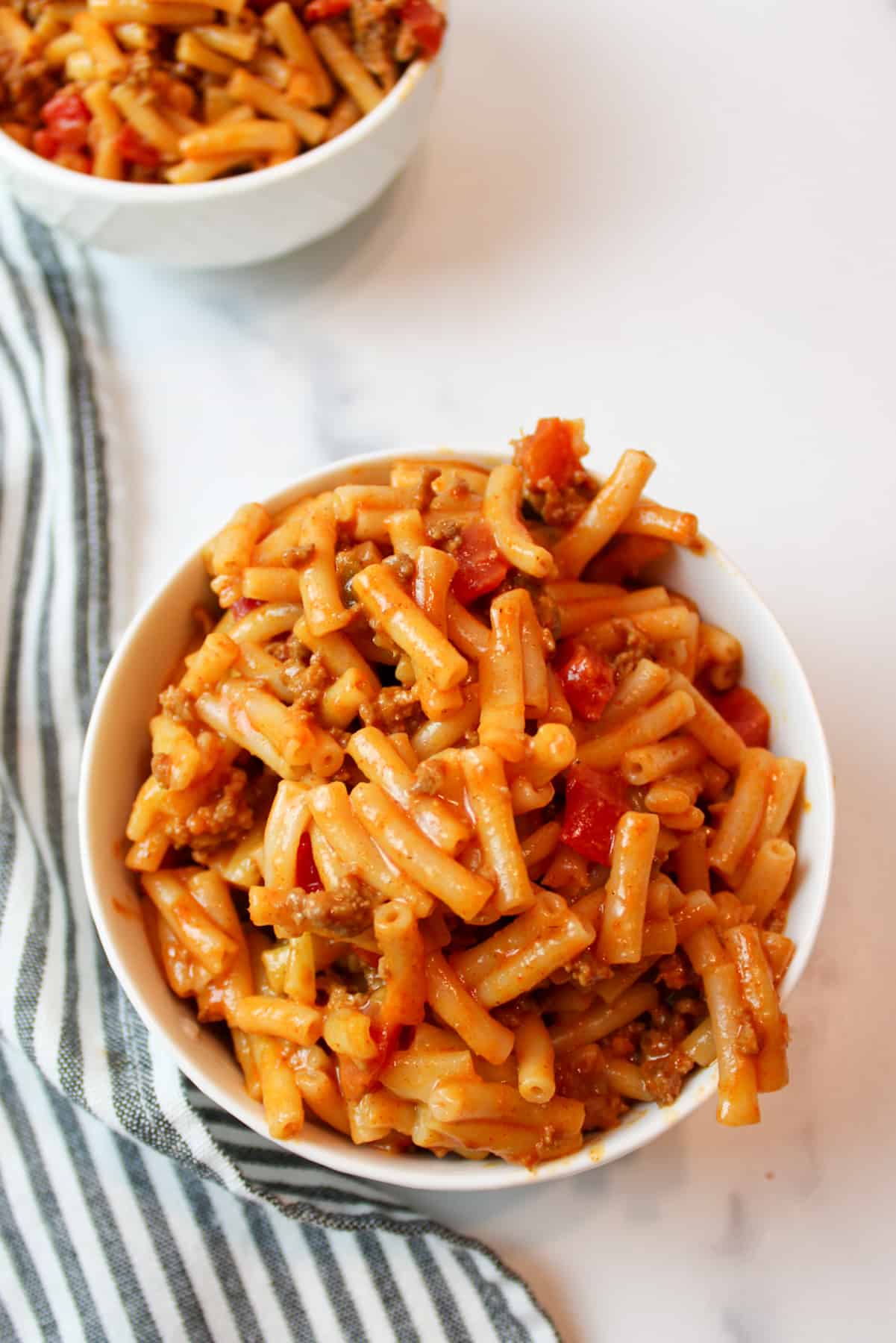 a bowl filled with taco mac and cheese.