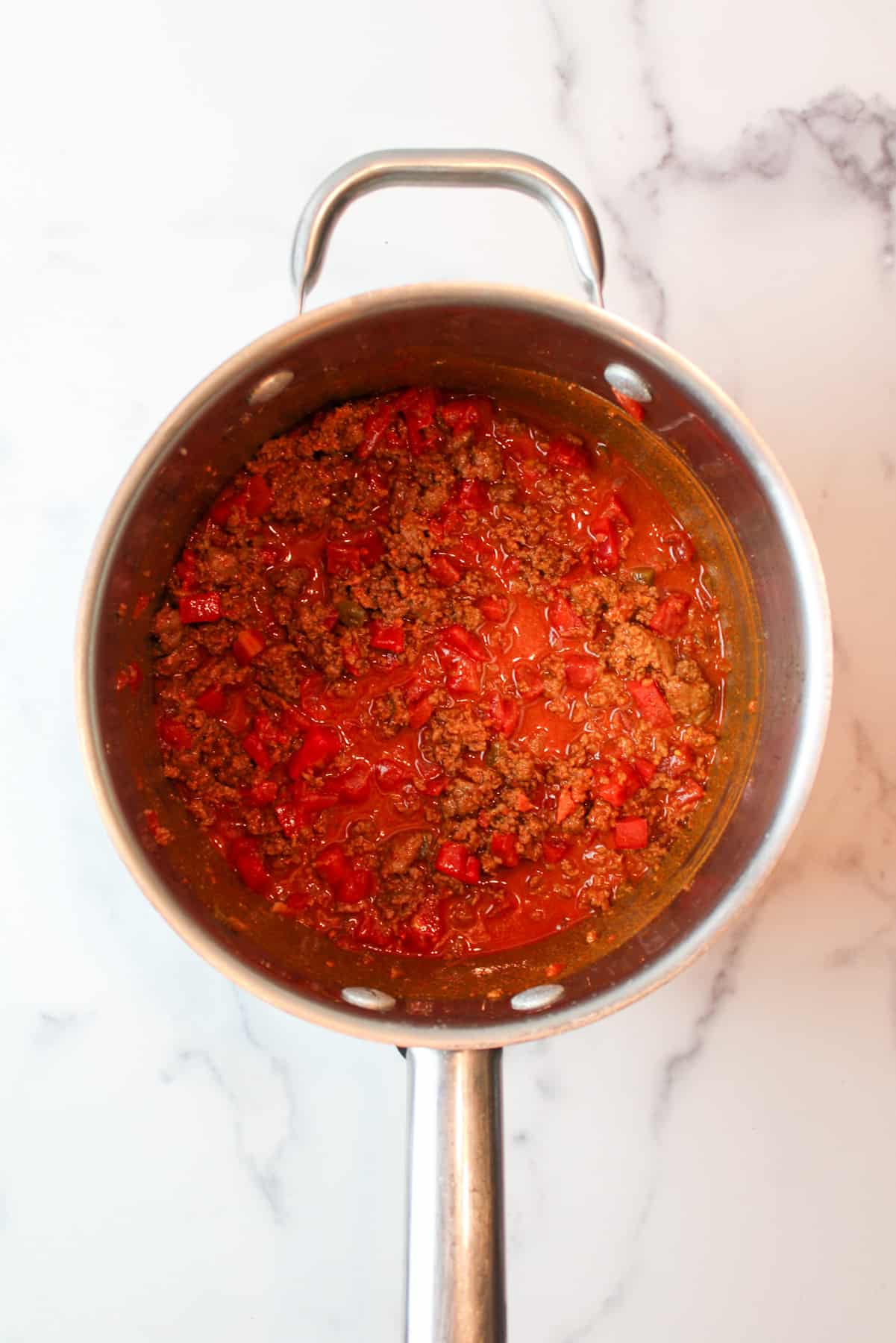 cooked tomato ground beef mixture in a pot