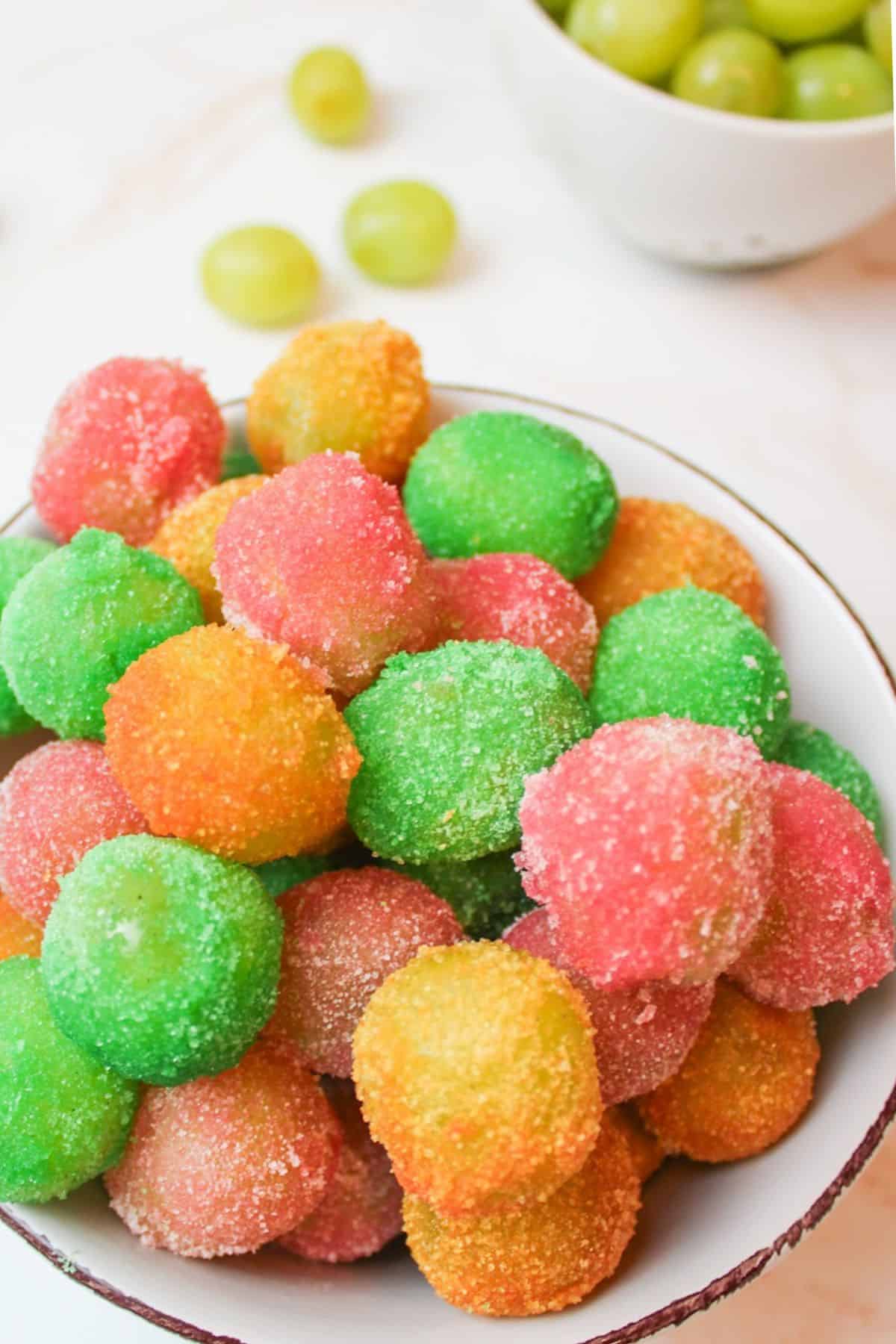 a bowl filled with sour patch grapes.