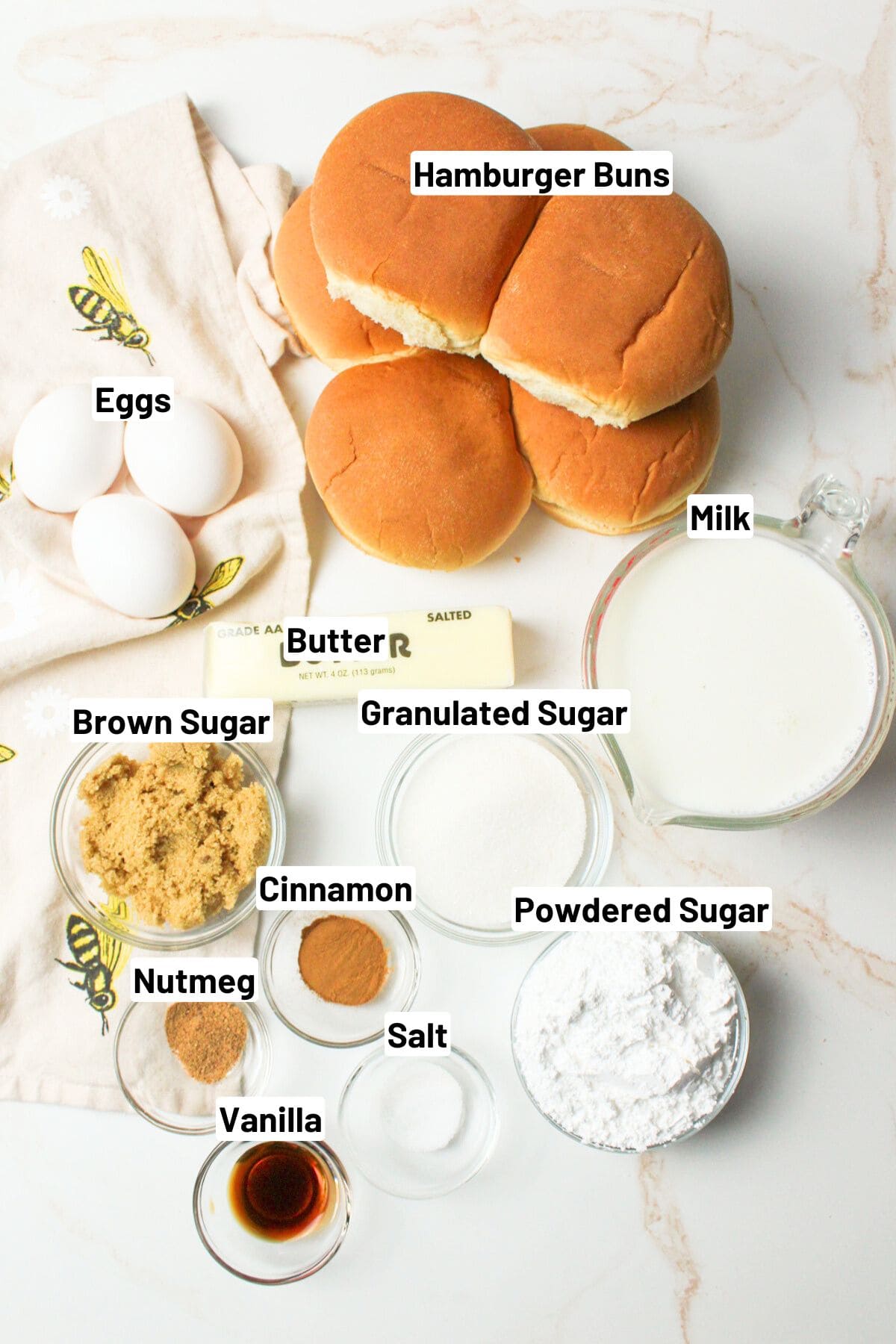 labeled ingredients needed to make bread pudding with hamburger buns.