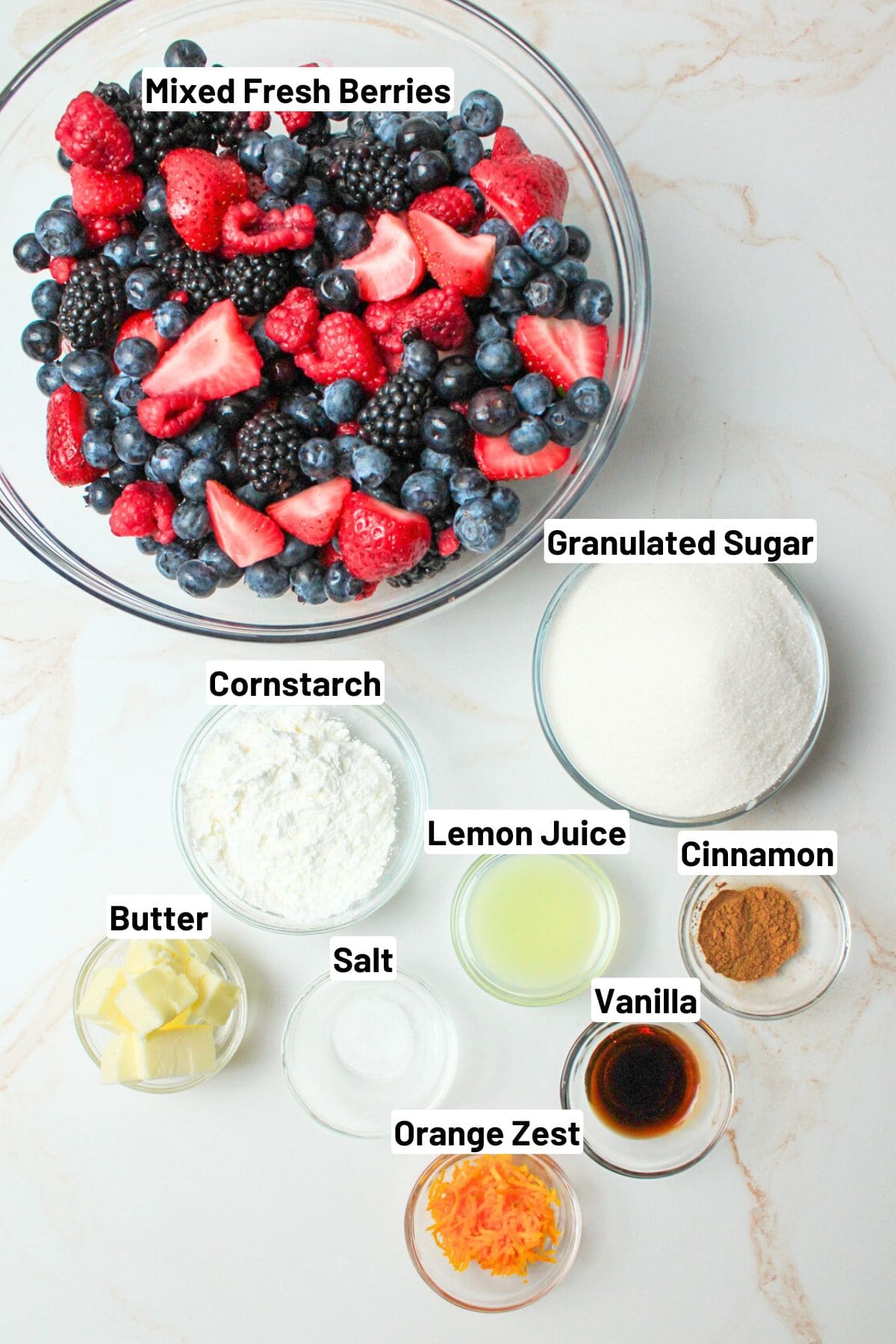 labeled ingredients needed to make mixed berry pie.
